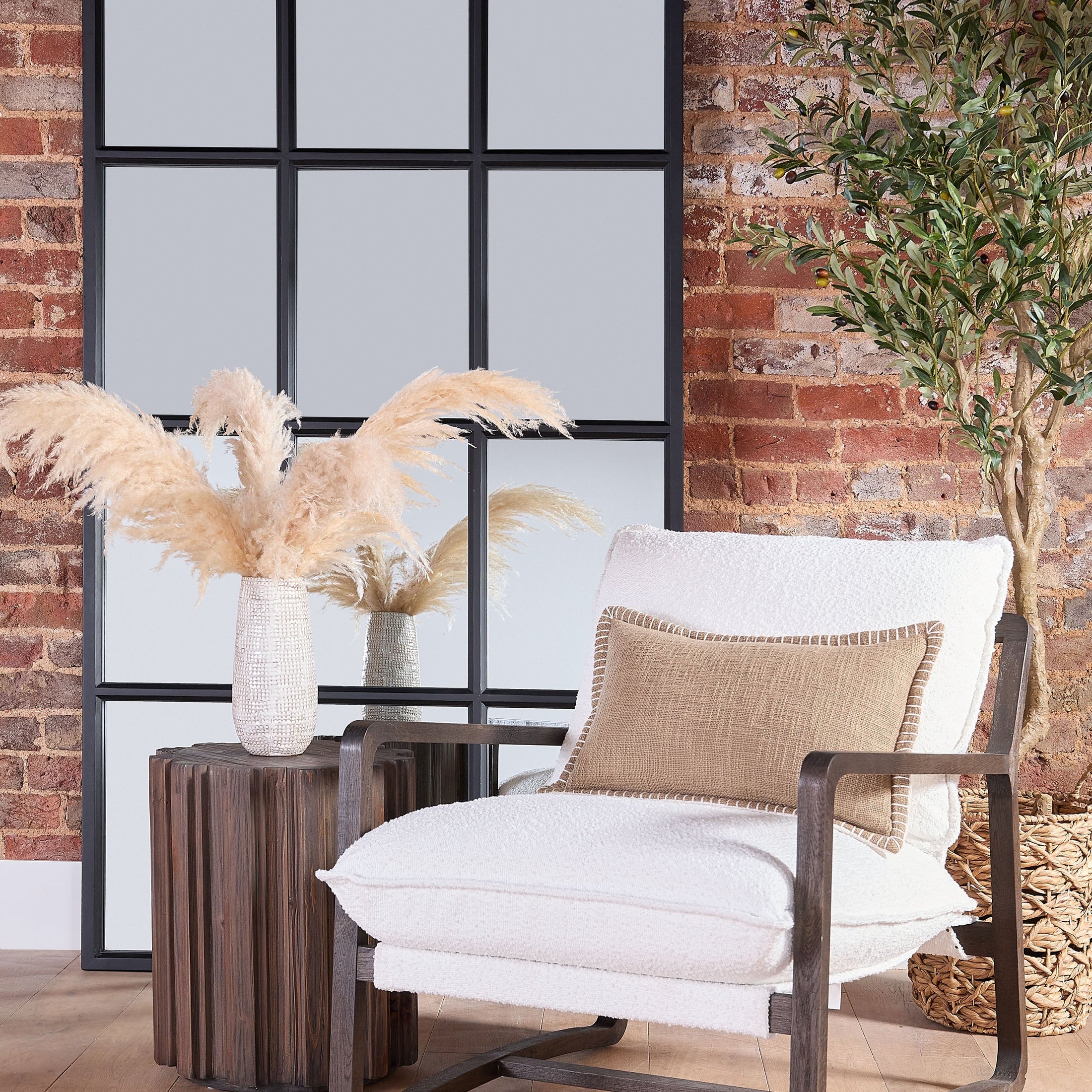 Roma Accent Table by Essentials For Living with fluted pedestal, drift brown finish, styled in cozy living room setting.
