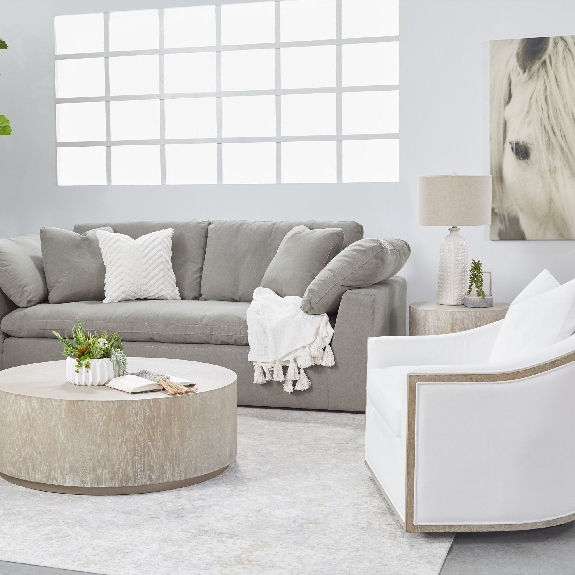 Round Roto Large Coffee Table with natural gray oak finish and brushed silver base in modern living room Essentials for Living