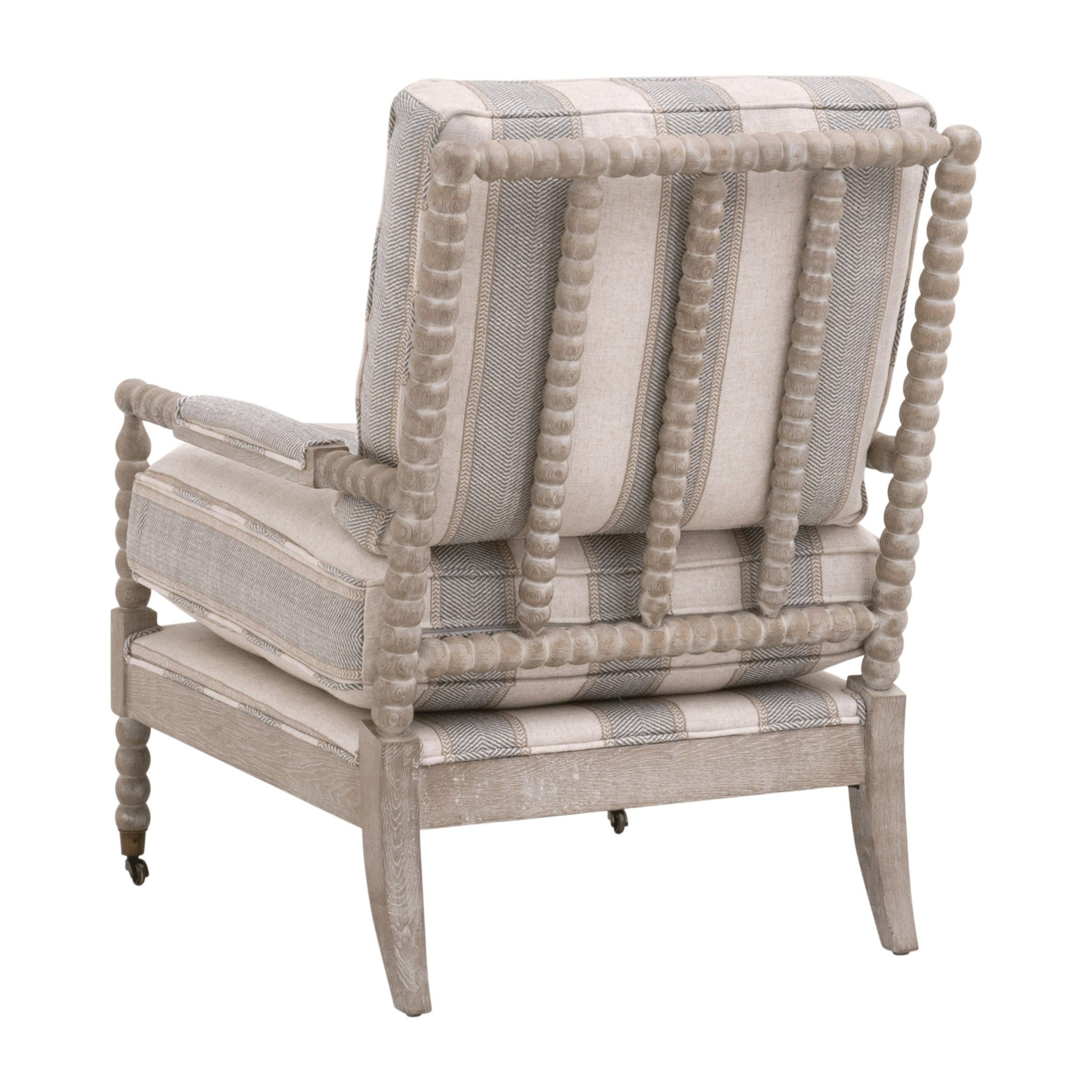 Essentials for Living Rouleau Club Chair with carved gray oak frame and striped upholstered cushions viewed from the back