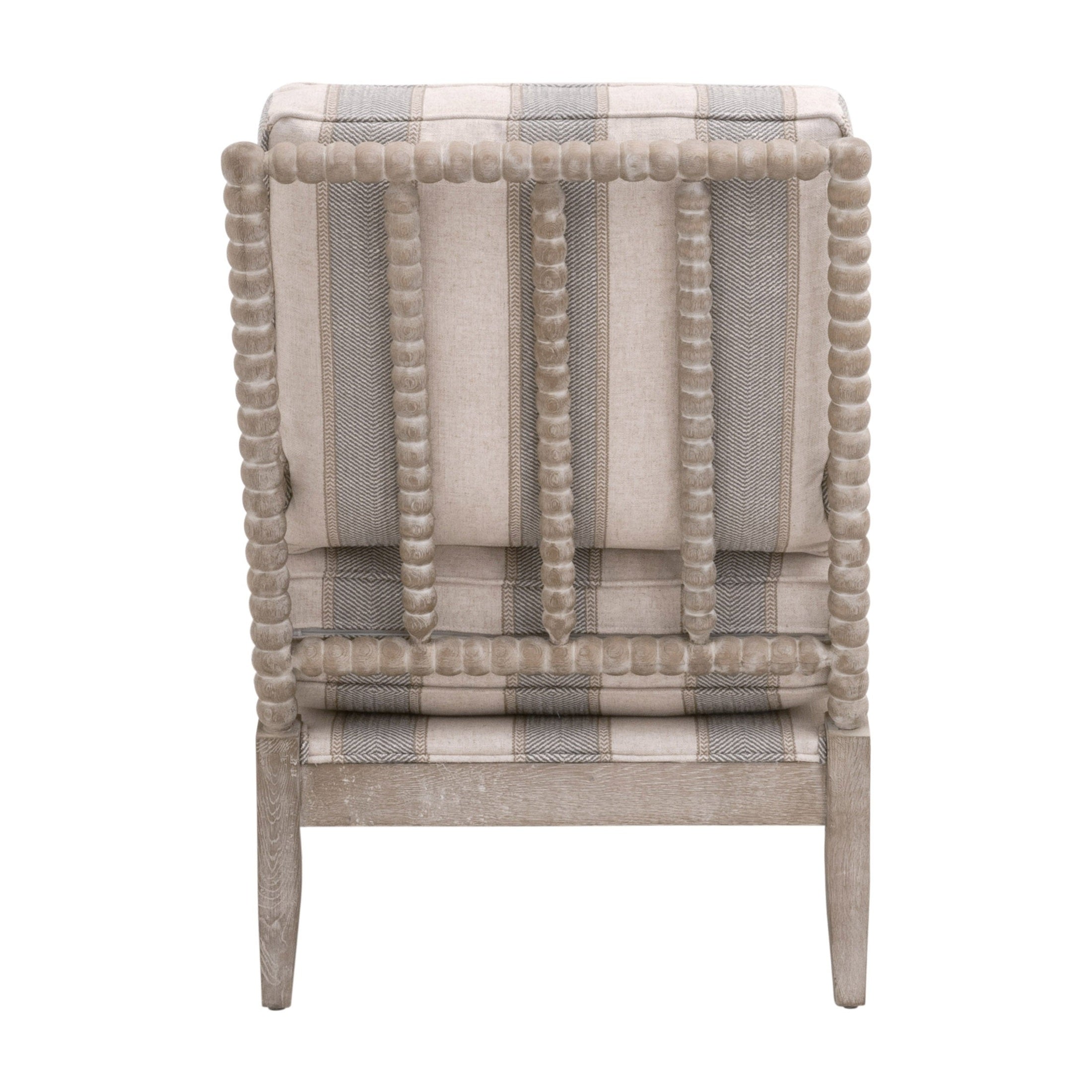 Back view of Rouleau Club Chair with hand-carved wood frame and striped upholstered cushion by Essentials For Living
