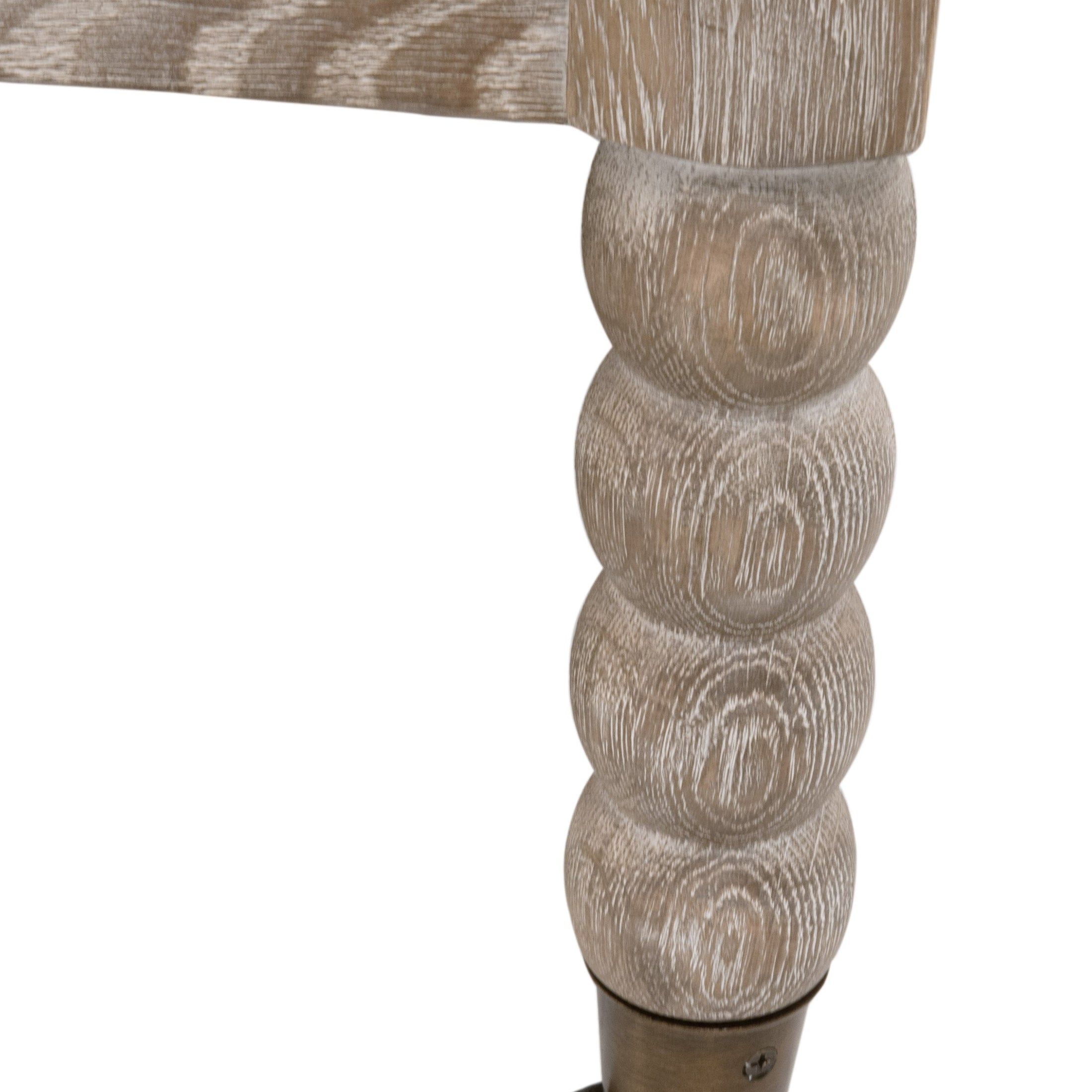 Close-up of Rouleau Club Chair’s hand-carved natural gray oak leg with spool detailing by Essentials for Living.