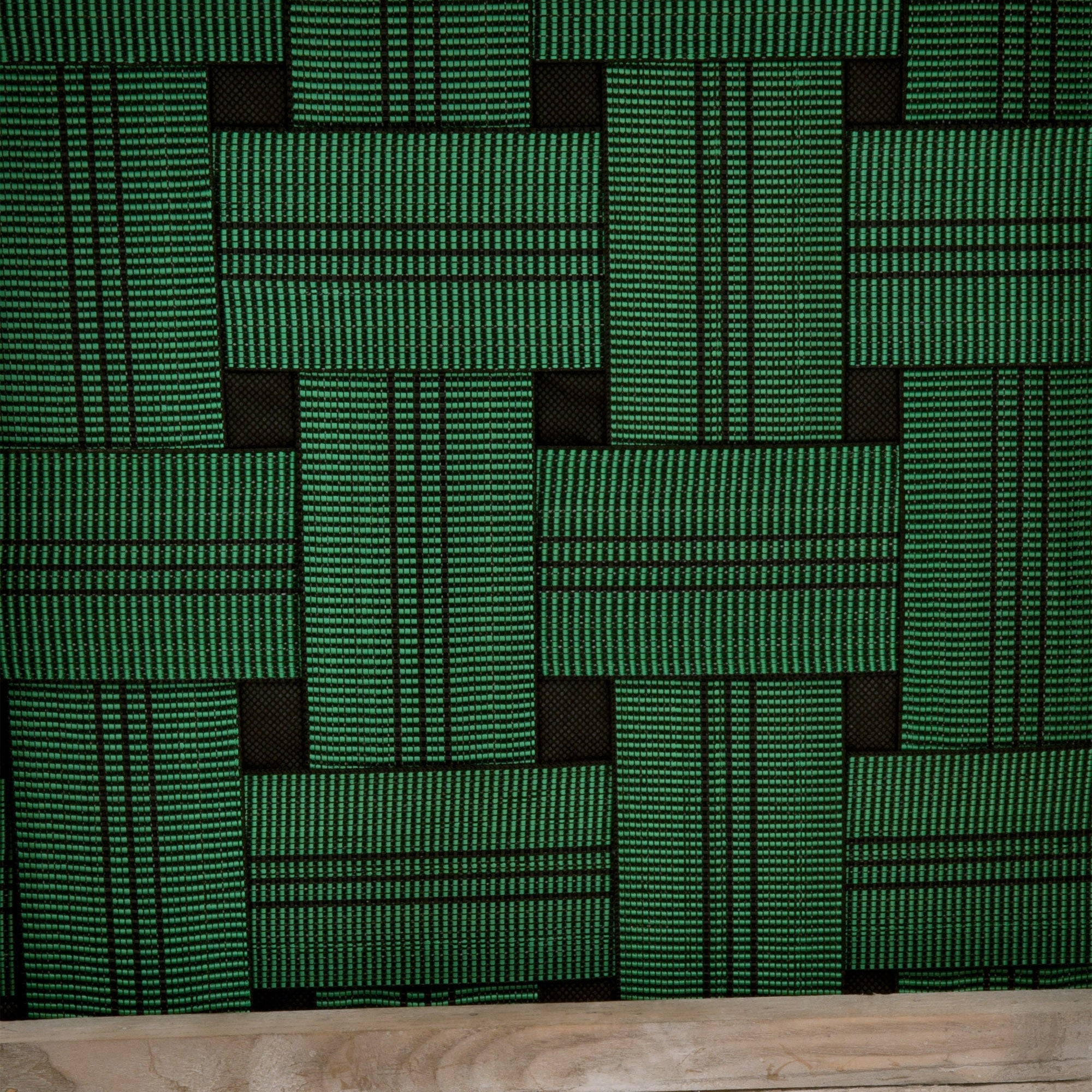 Close-up of green and black woven fabric pattern on Essentials for Living Rue Counter Stool upholstery