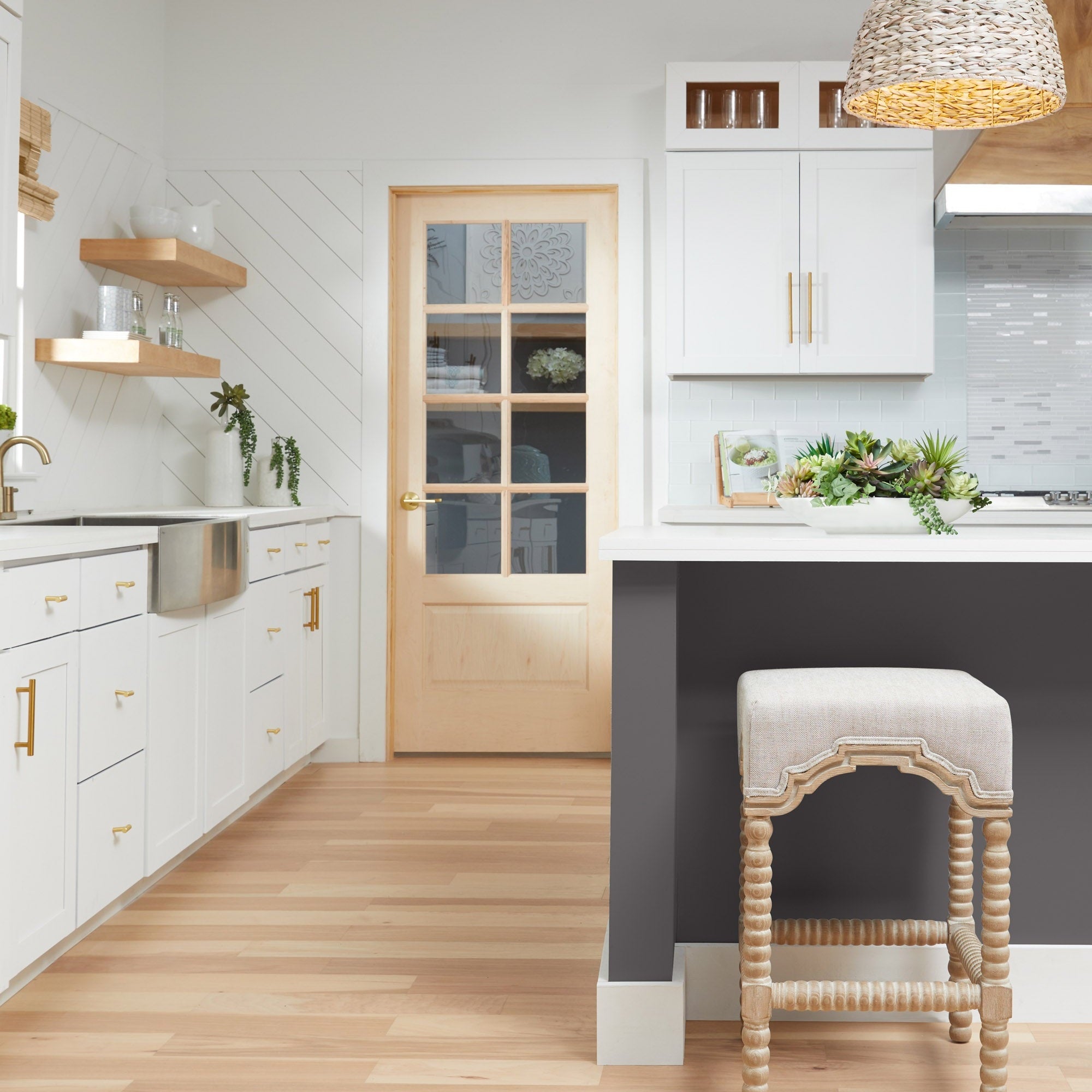 Rue Counter Stool by Essentials for Living with bisque linen upholstery and natural gray ash wood frame in bright kitchen setting
