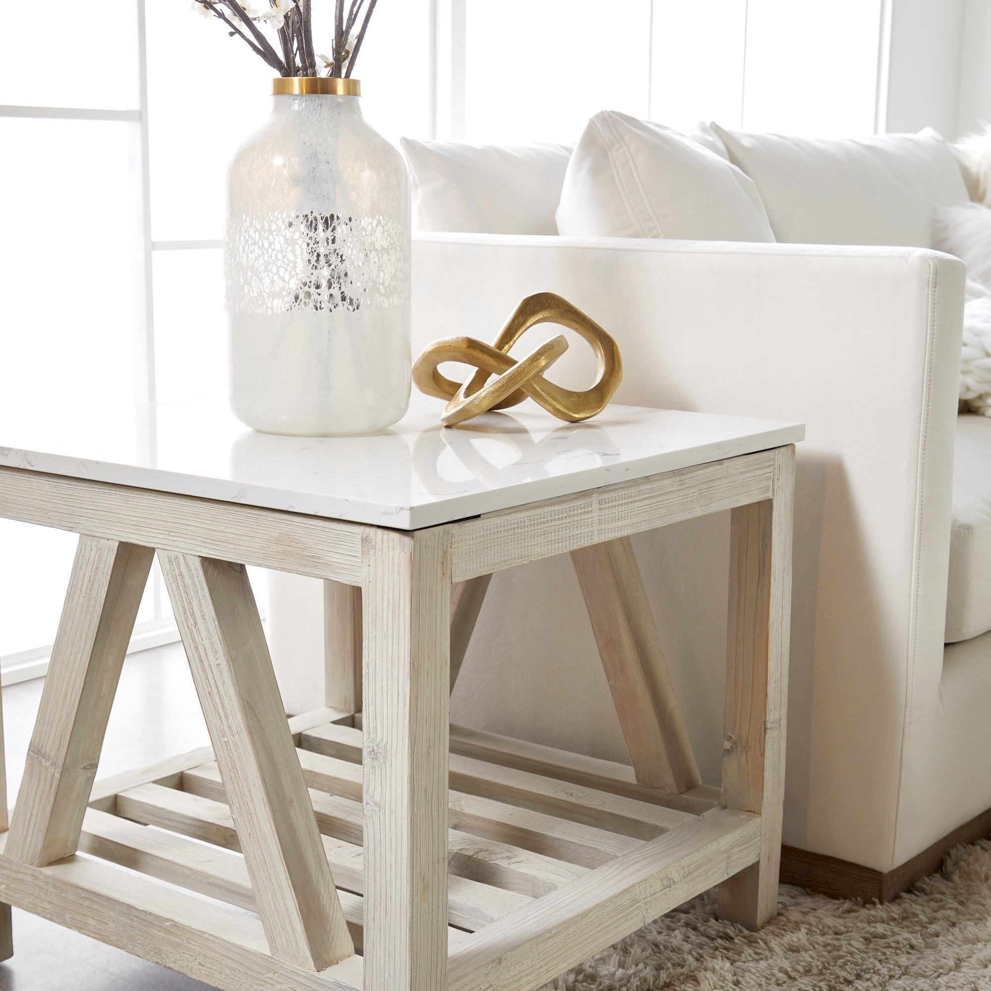Ivory LiveSmart fabric Siena 96" sofa with plush cushions and exposed wood plinth base in a bright living room setting