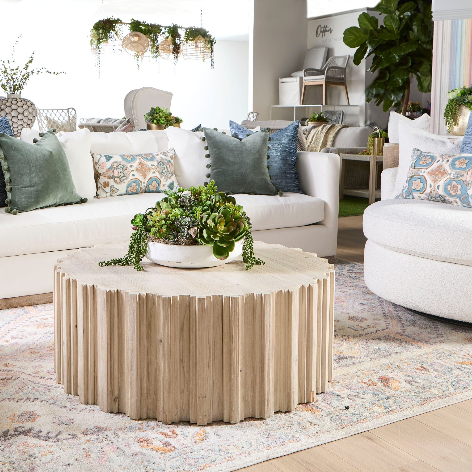 Essentials for Living Siena 96" sofa in ivory fabric with down blend cushions and wood plinth base in stylish living room.