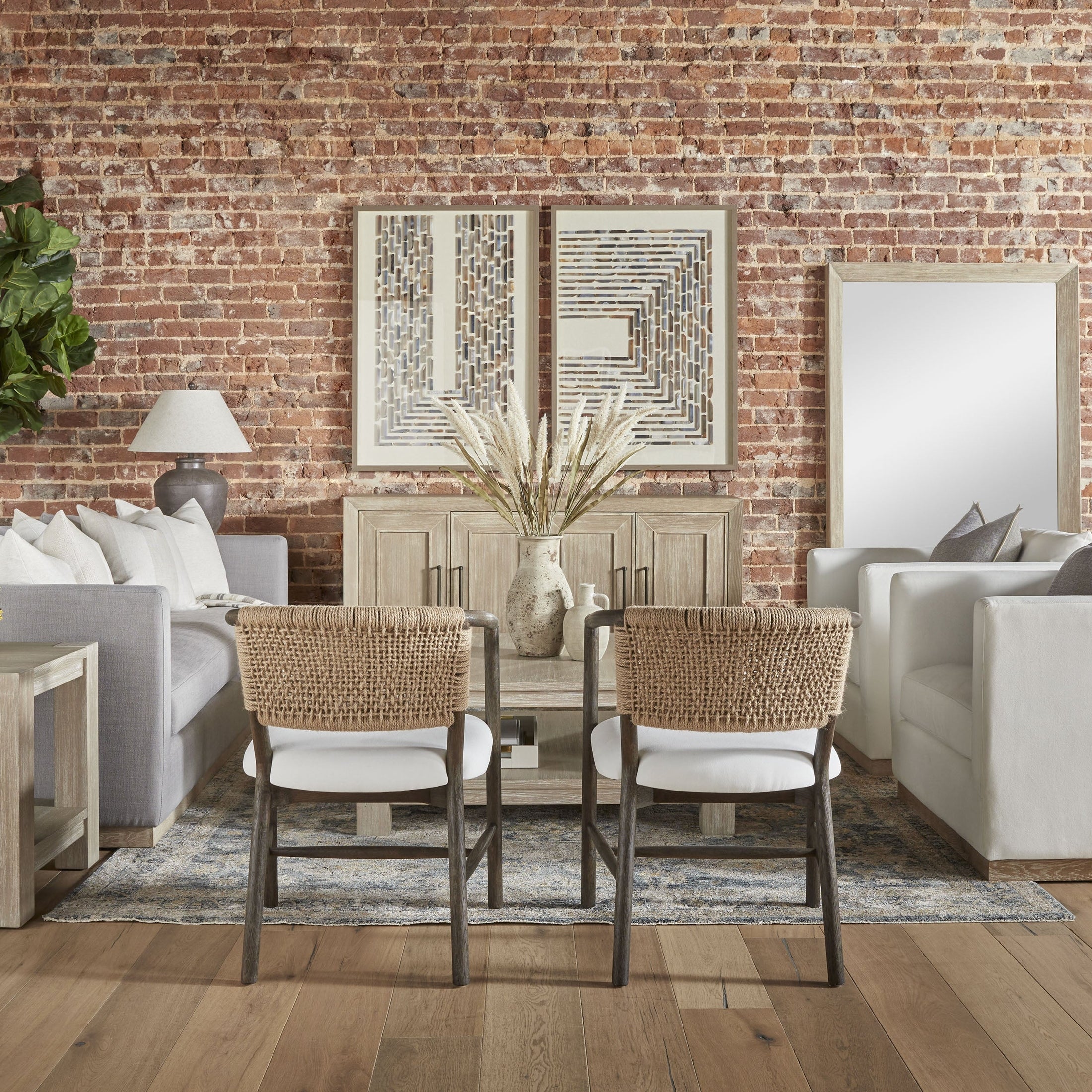 Modern living room with Siena 96" ivory sofa by Essentials for Living, featuring wood plinth base and cozy cushions.