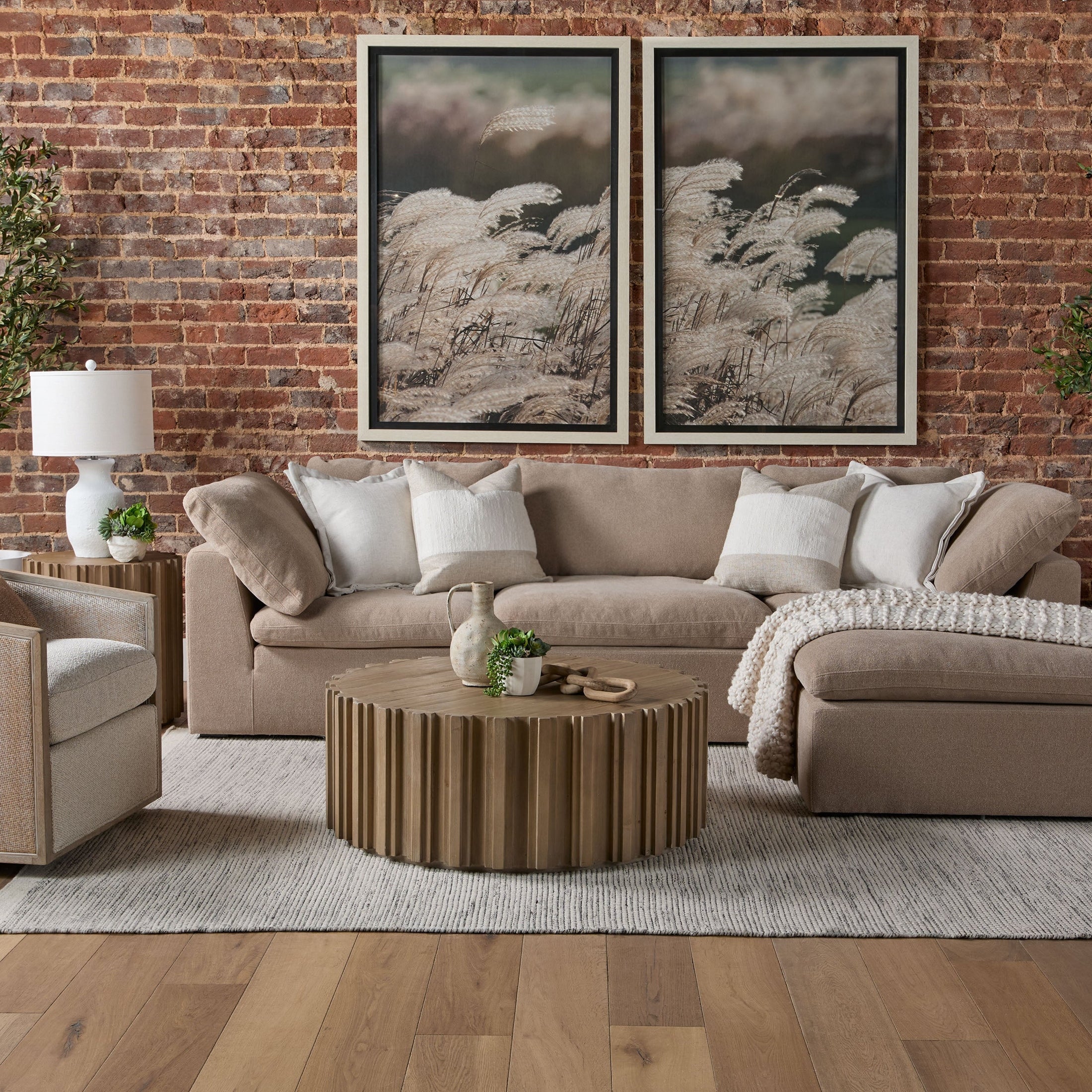 Sky Modular Armless Chair upholstered in soft neutral fabric in a cozy modern living room setting by Essentials For Living