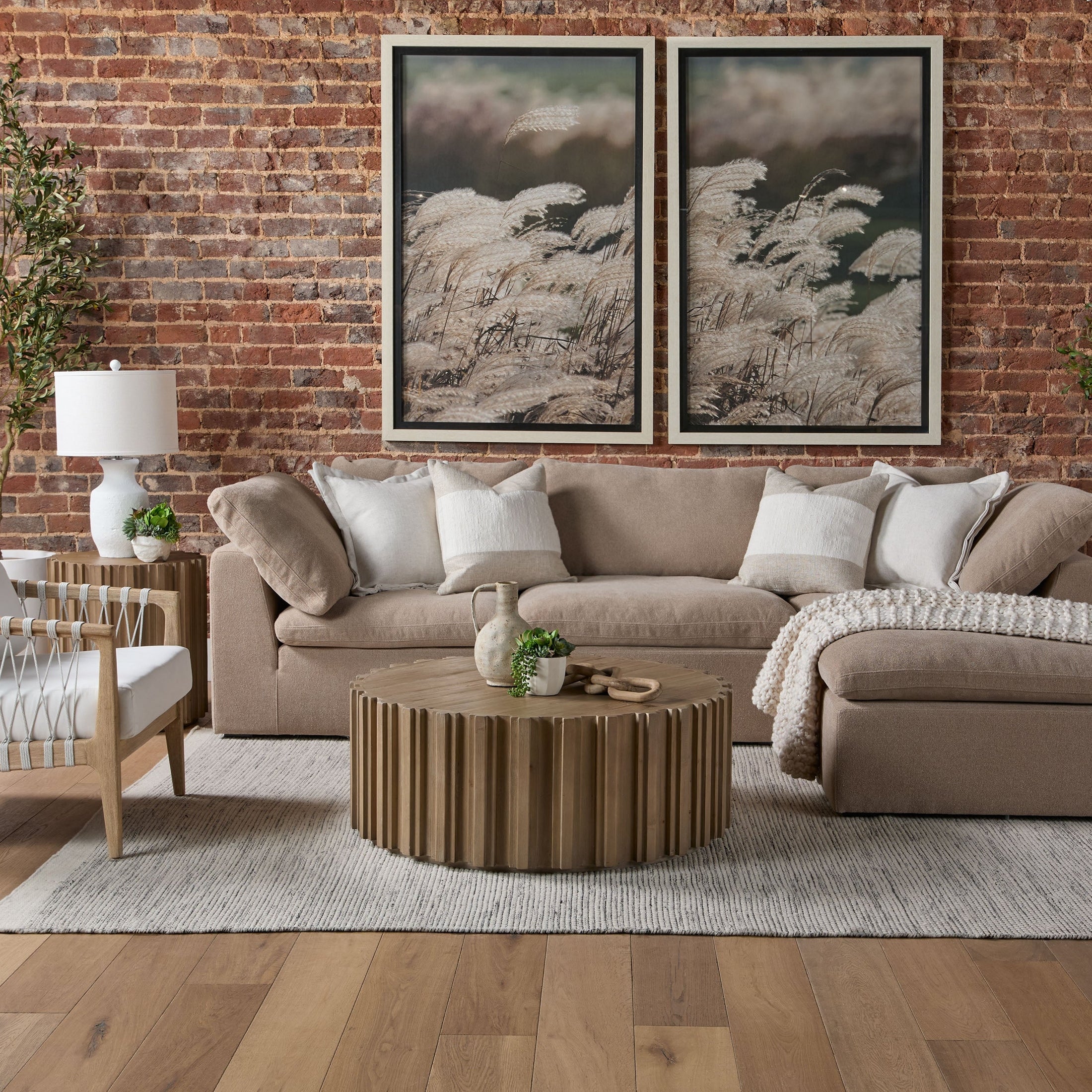 Sky Modular Ottoman in gray fabric with plush cushion and dark espresso birch wood feet in modern living room setting