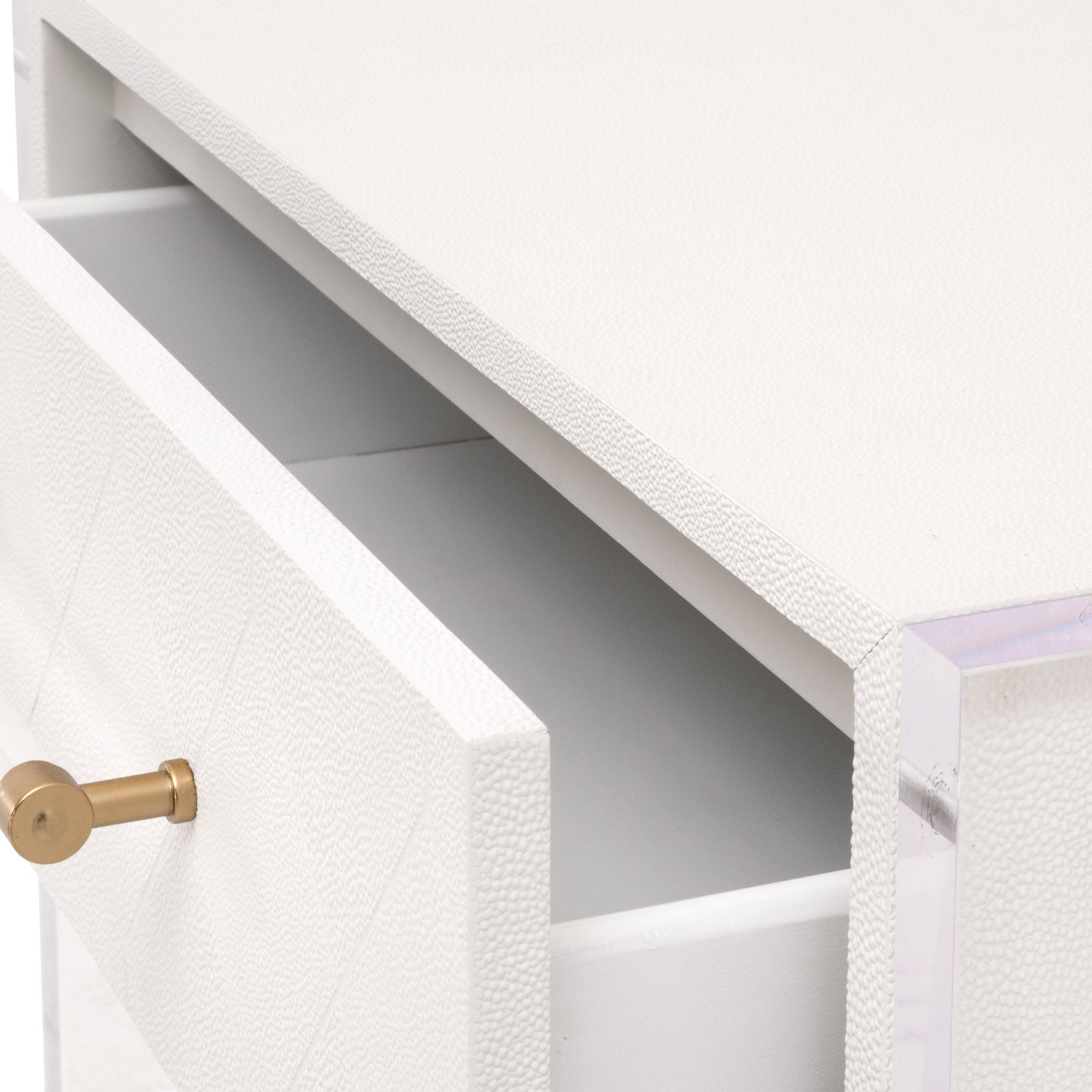 Close-up of open drawer on pearl-white faux shagreen nightstand with brushed brass handle and clear acrylic sides by Essentials for Living