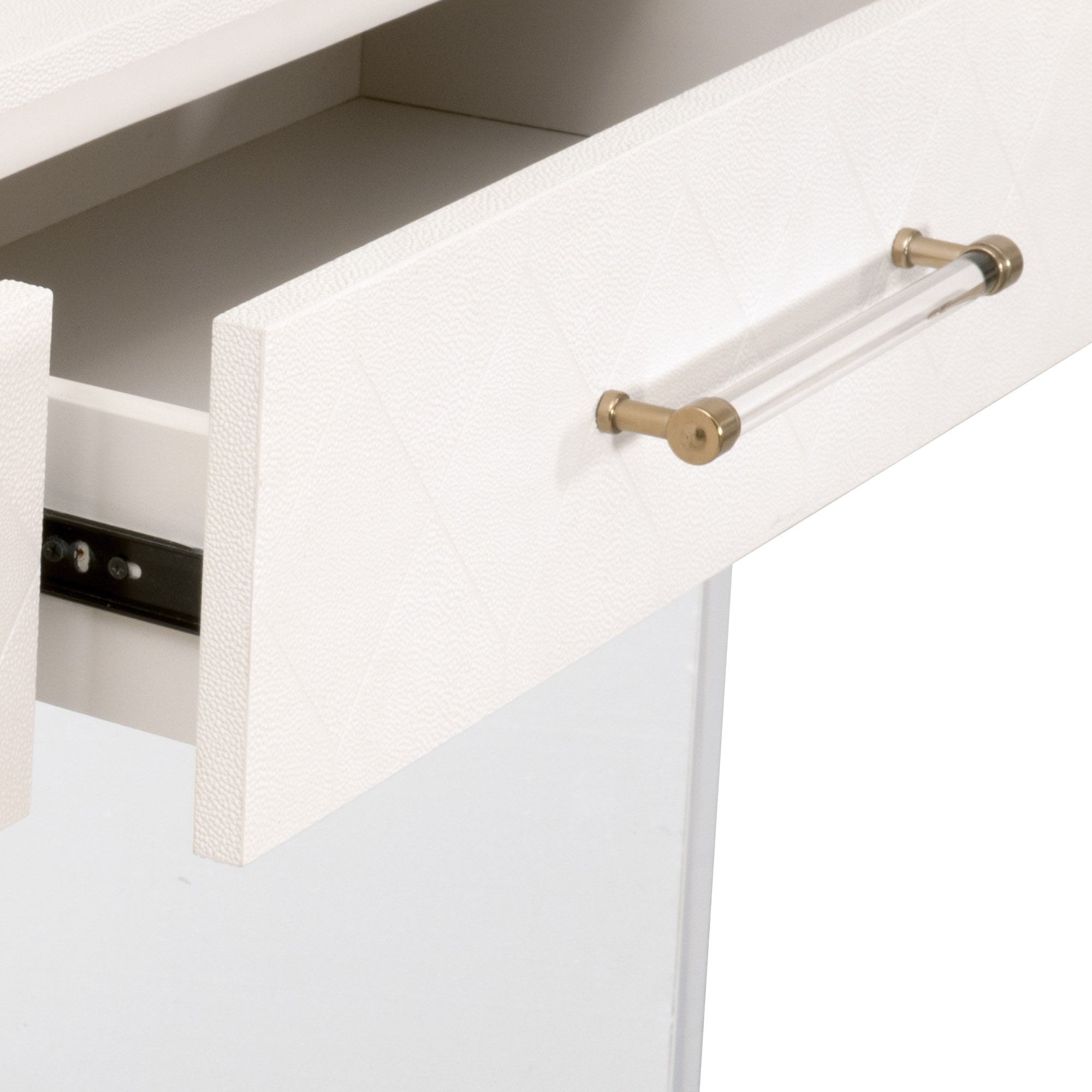 Close-up of pearl faux shagreen drawer with clear acrylic and brushed brass handle on Essentials For Living Sonia Console Table