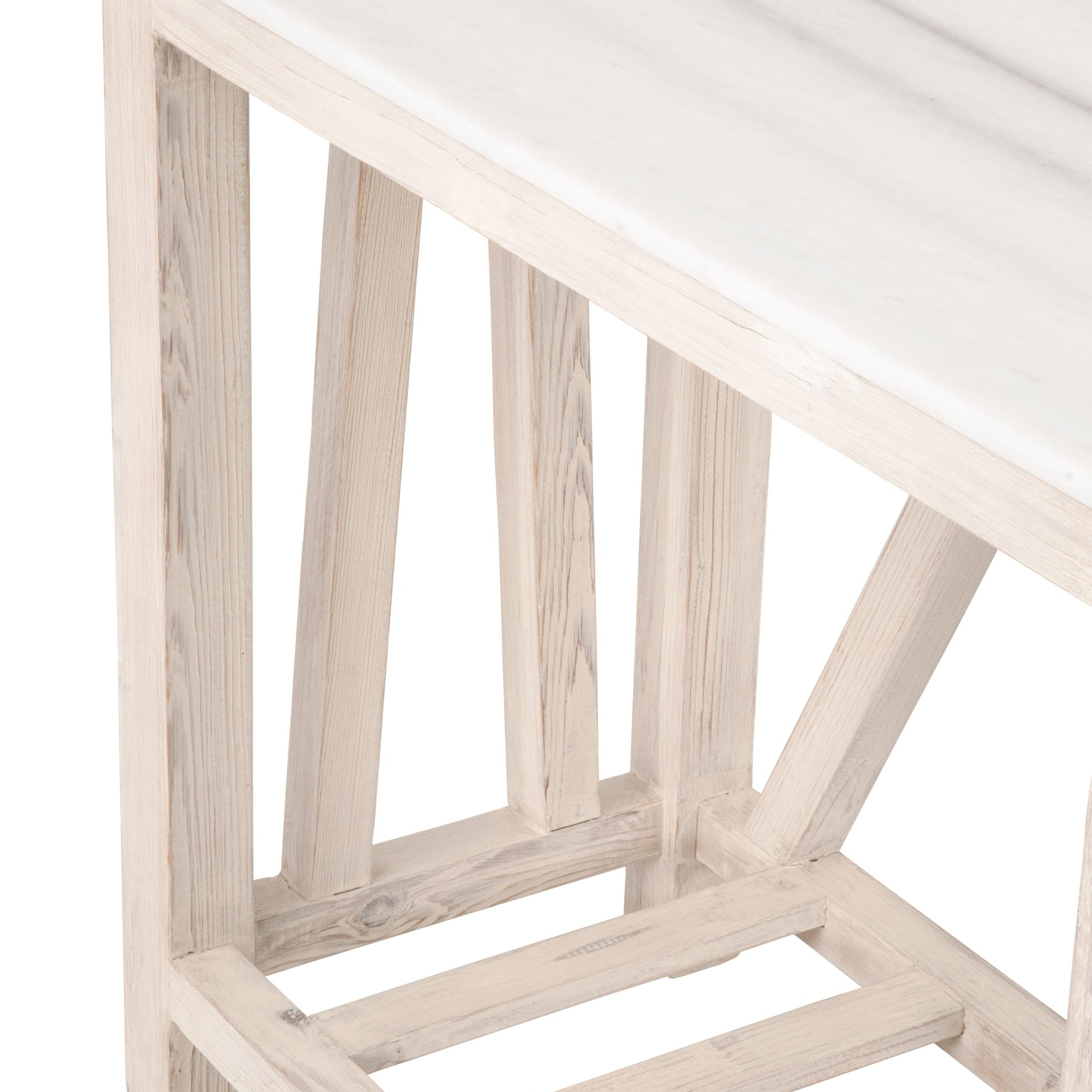Close-up of the whitewash pine trestle base and solid quartz top with marble-inspired veining on the Spruce Console Table