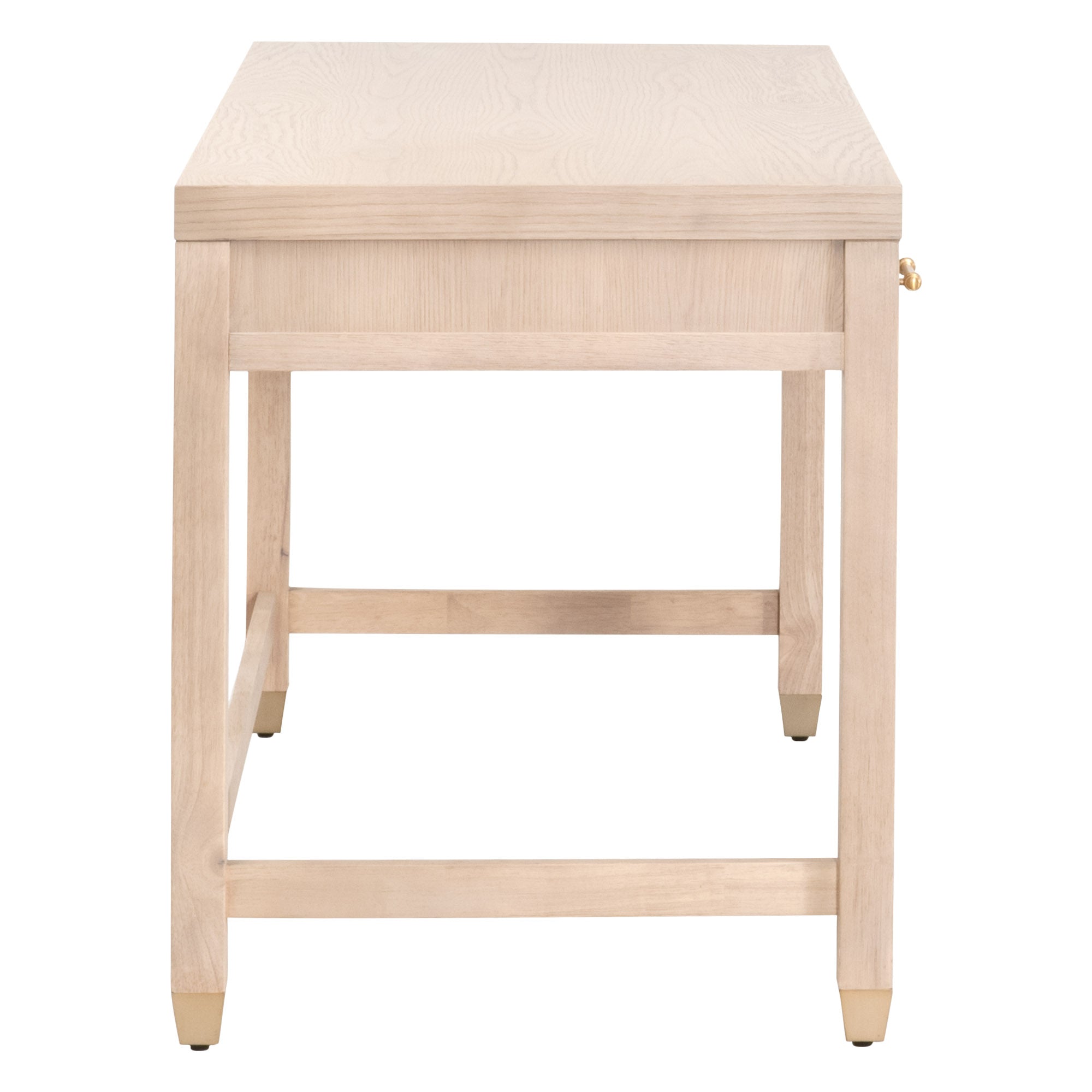 Side view of the Essentials For Living Stella Desk in natural wood finish with brass feet accents