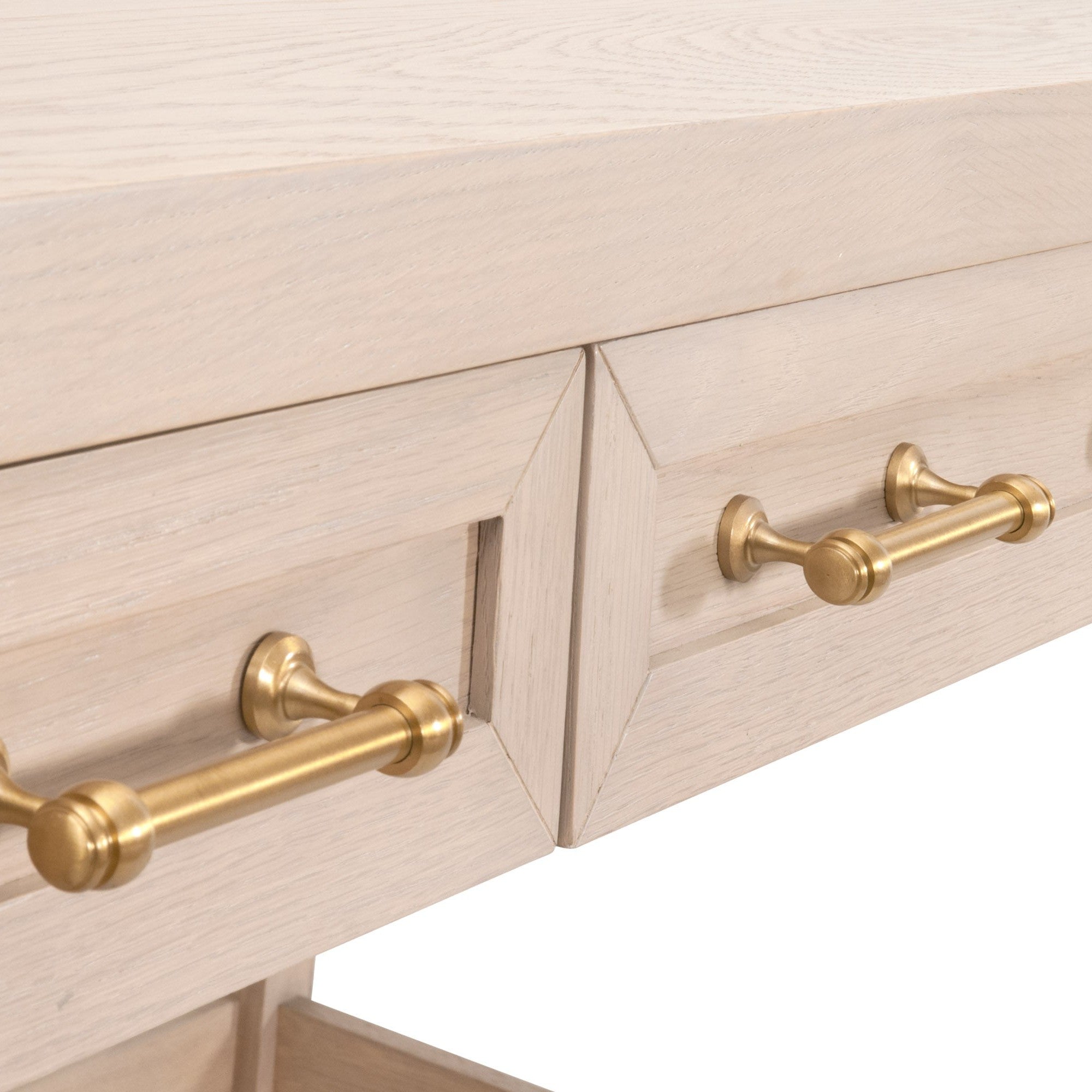 Close-up of Stella Desk drawers showing brushed brass handles on white lacquered solid wood by Essentials For Living