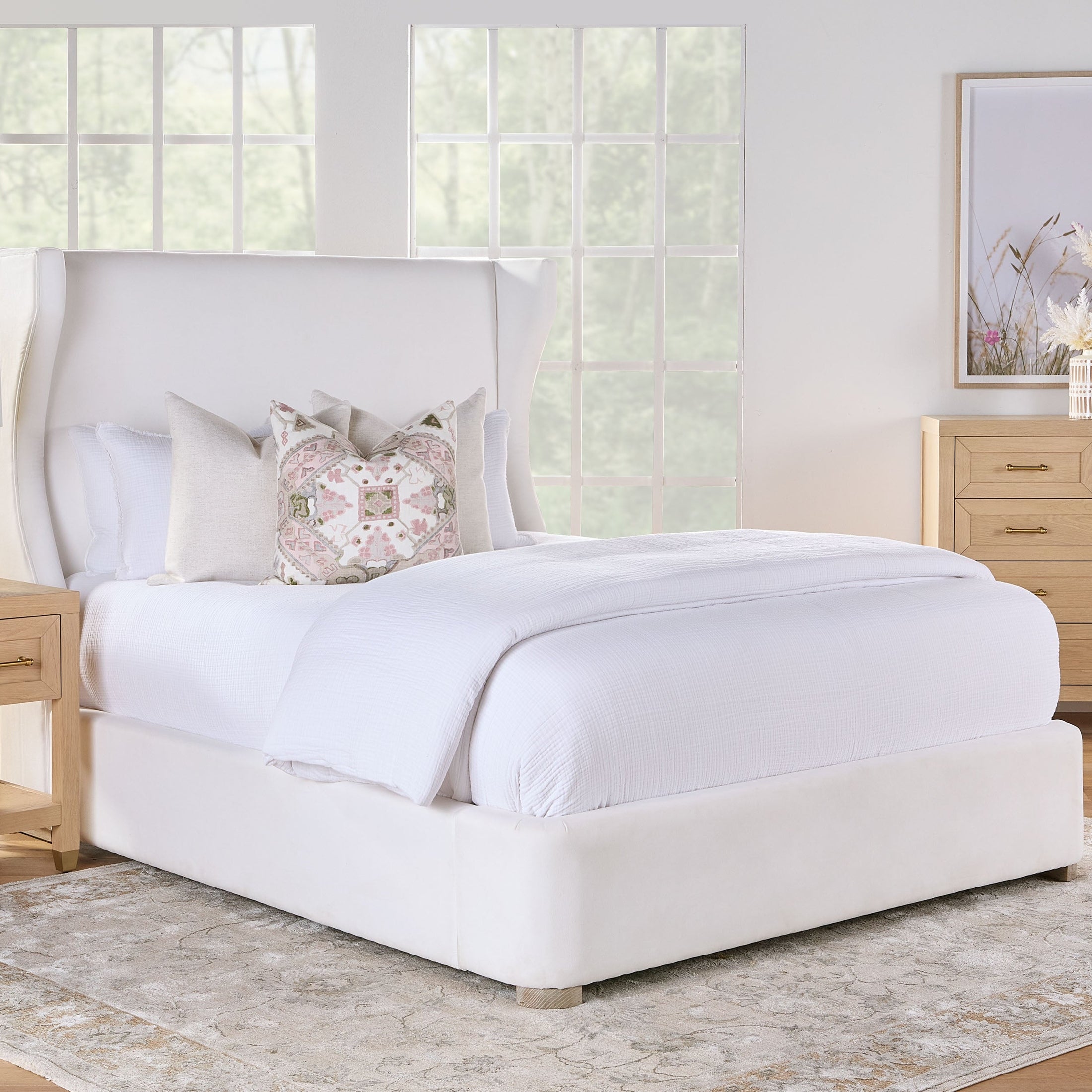 Essentials For Living Stella 5-Drawer High Chest in matte white lacquer with brushed brass hardware in a bedroom setting