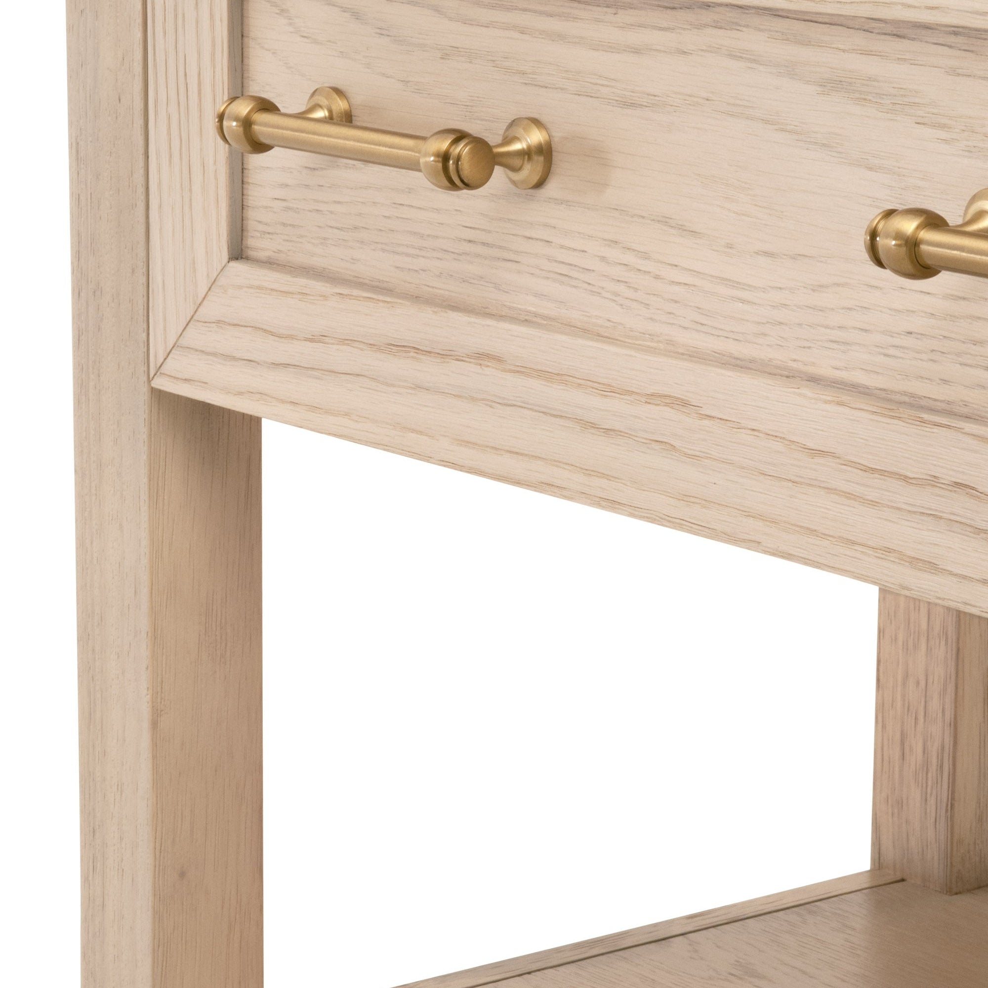 Close-up of Stella nightstand drawer with brushed brass handle and light wood grain finish by Essentials For Living