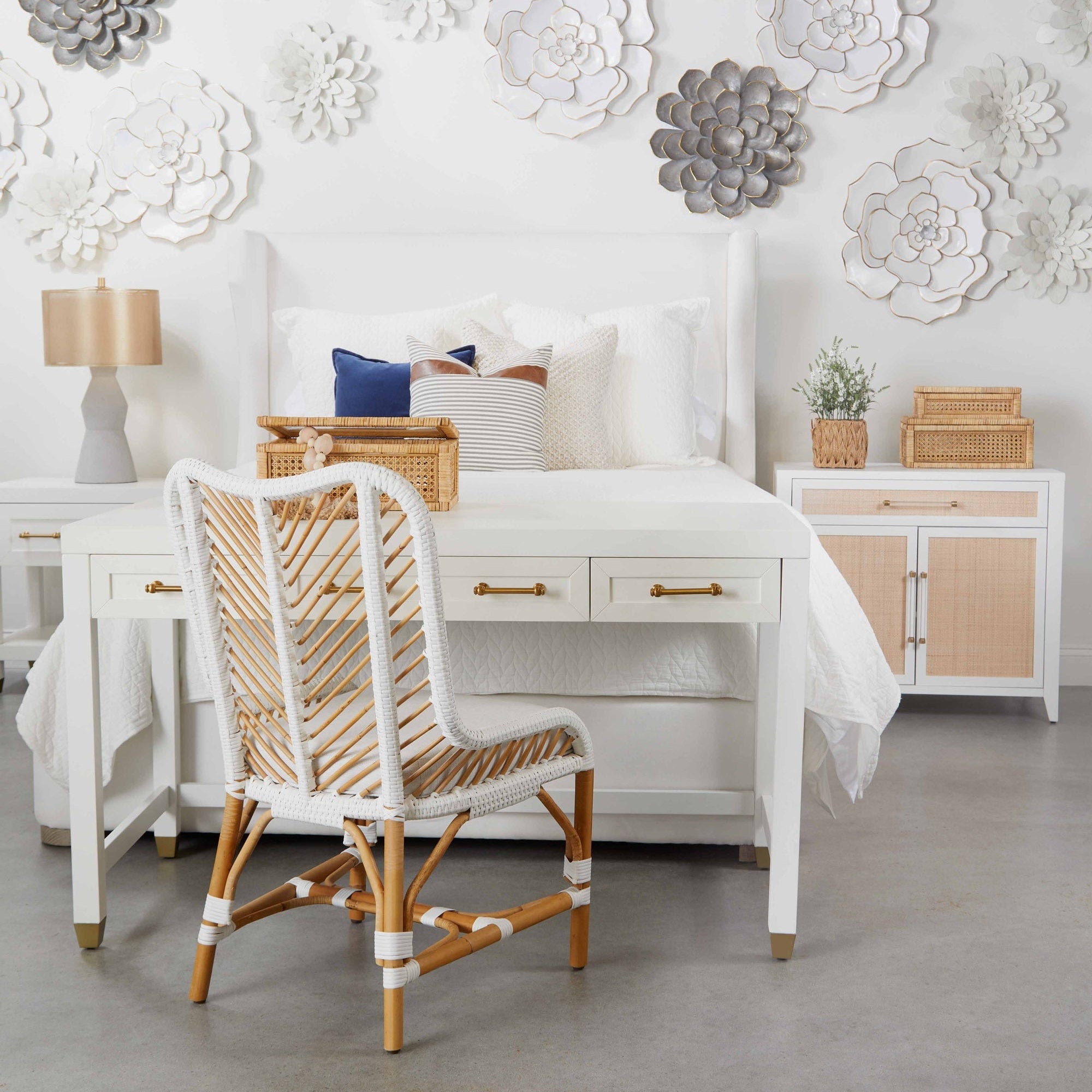 Stella Desk by Essentials For Living with matte white finish and brass handles placed in a bright, modern bedroom setting