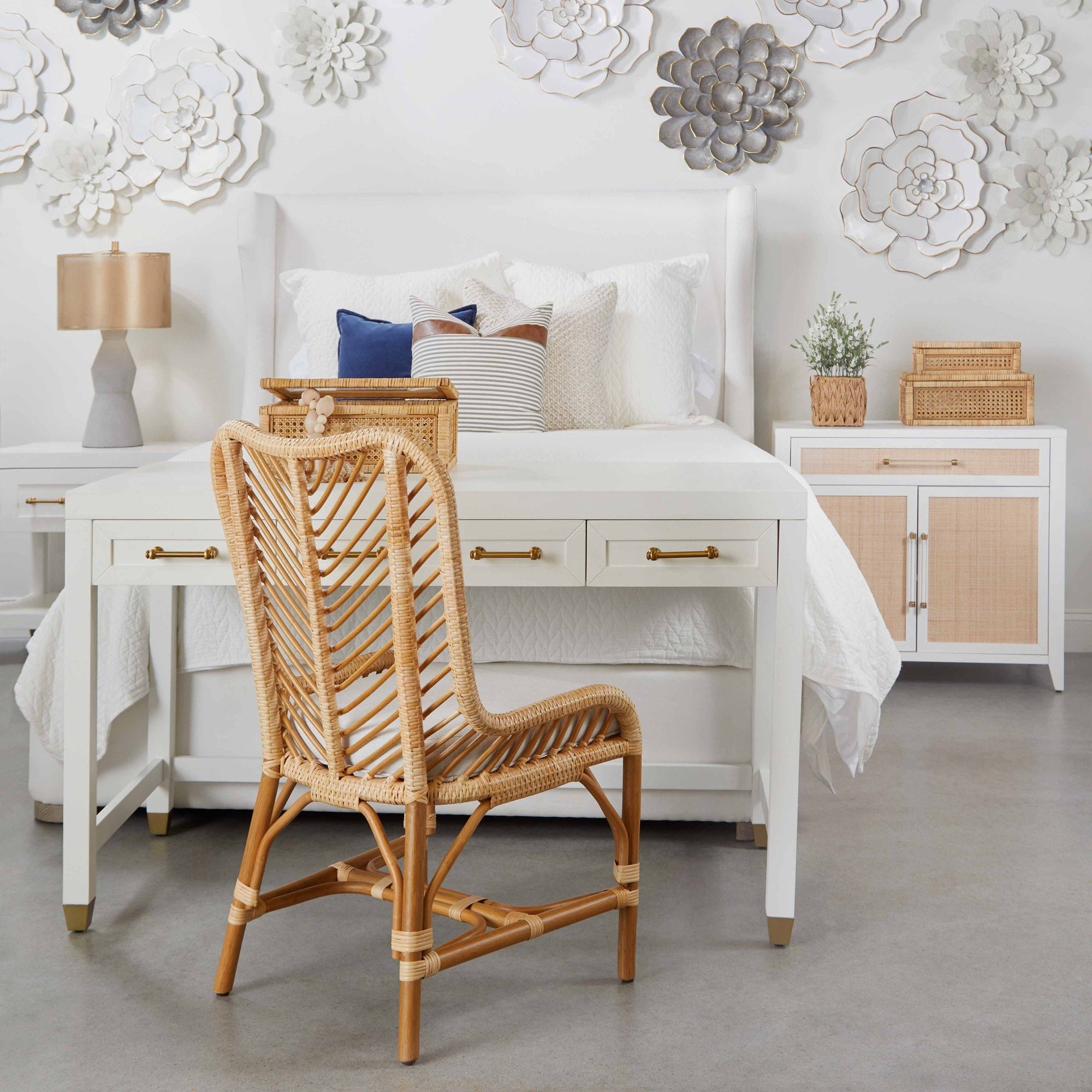 Essentials For Living Stella Desk in white lacquer with brass handles beside bed in stylish modern bedroom setting