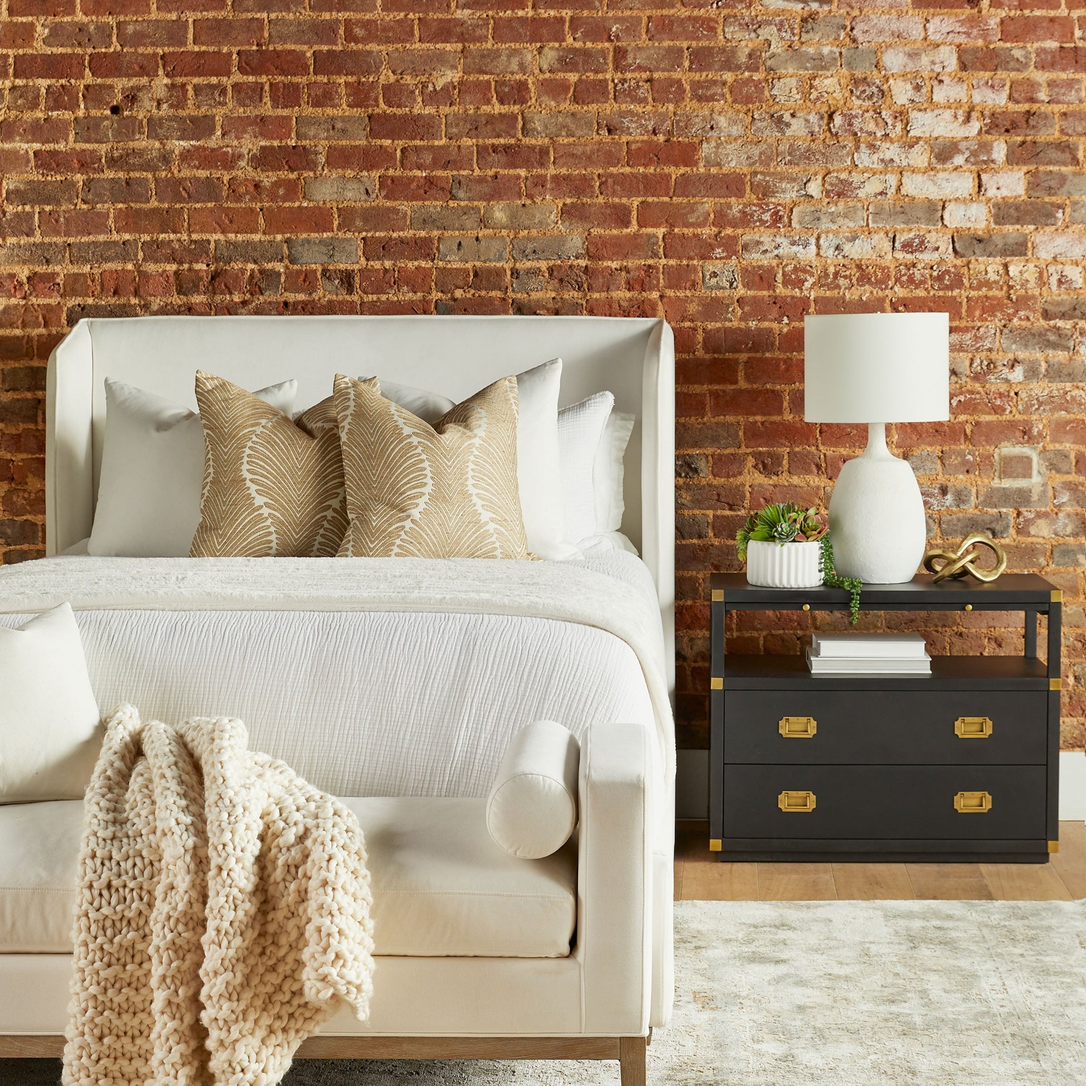 Essentials for Living Stewart Standard King Bed in natural gray oak with LiveSmart Peyton-Pearl upholstery in a cozy bedroom setting