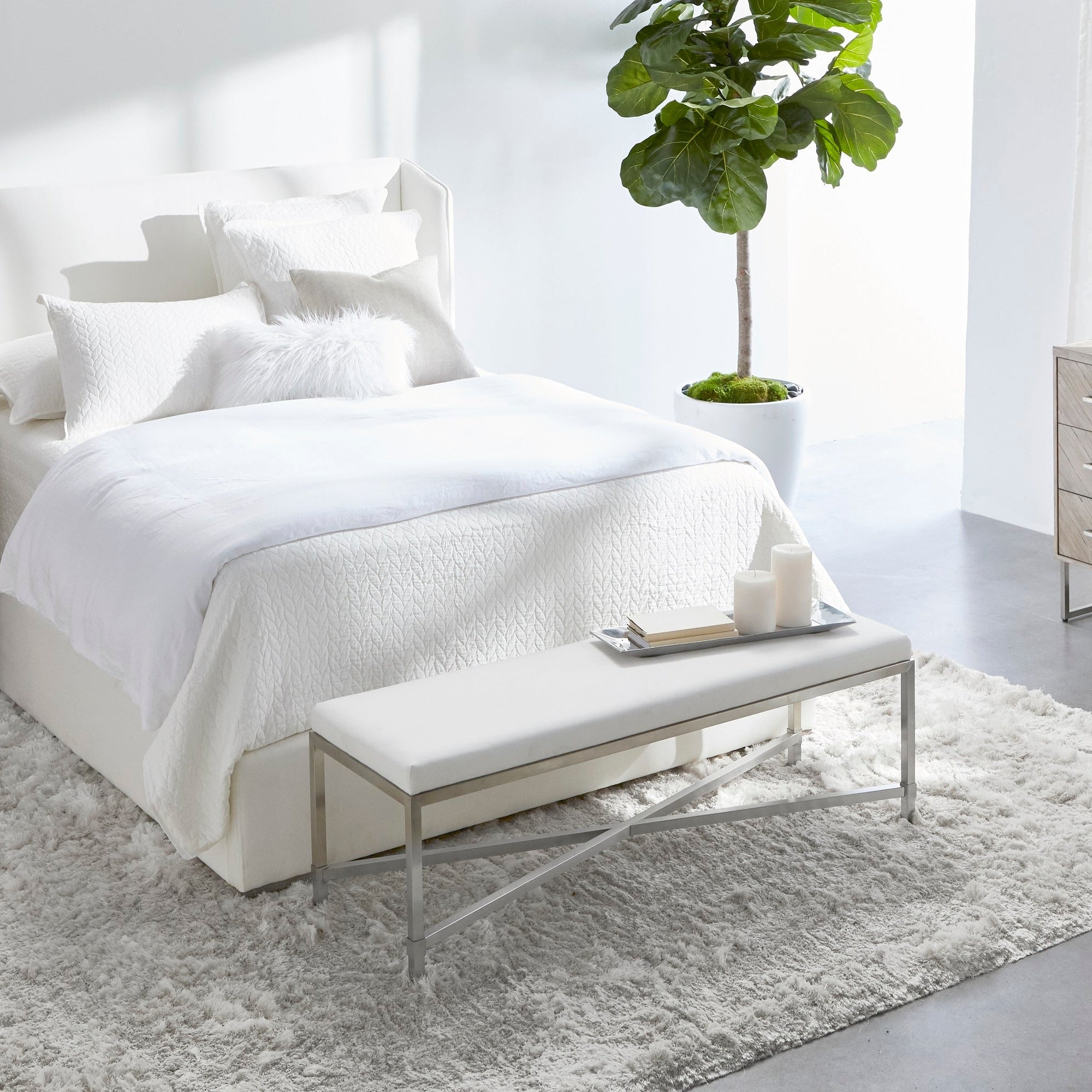 Modern bedroom with Stewart Standard King Bed in light upholstery, soft bedding, and a plush rug for a cozy retreat