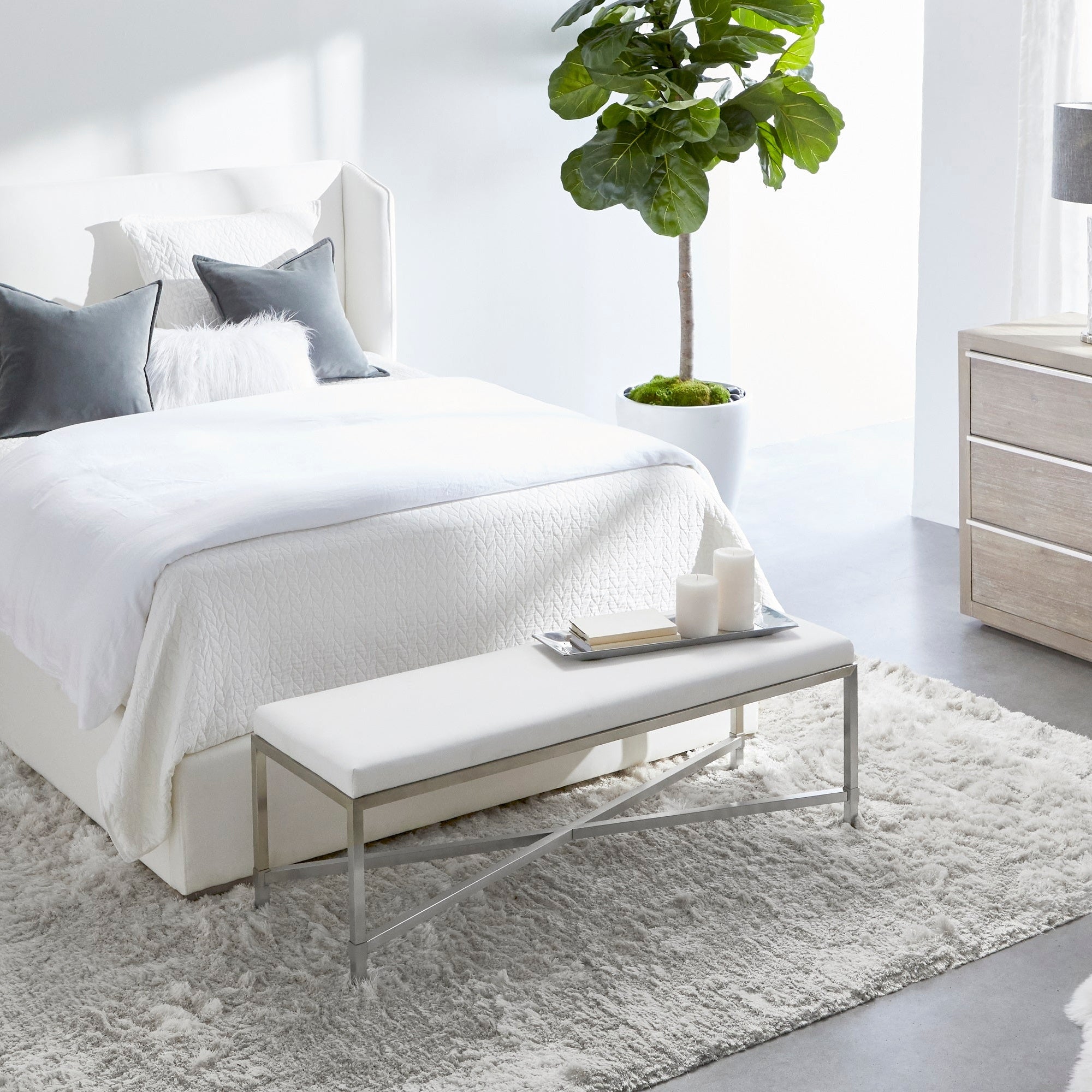 Essentials For Living Stewart Cal King Bed with wingback headboard, LiveSmart upholstery, and natural gray oak legs in bright bedroom.