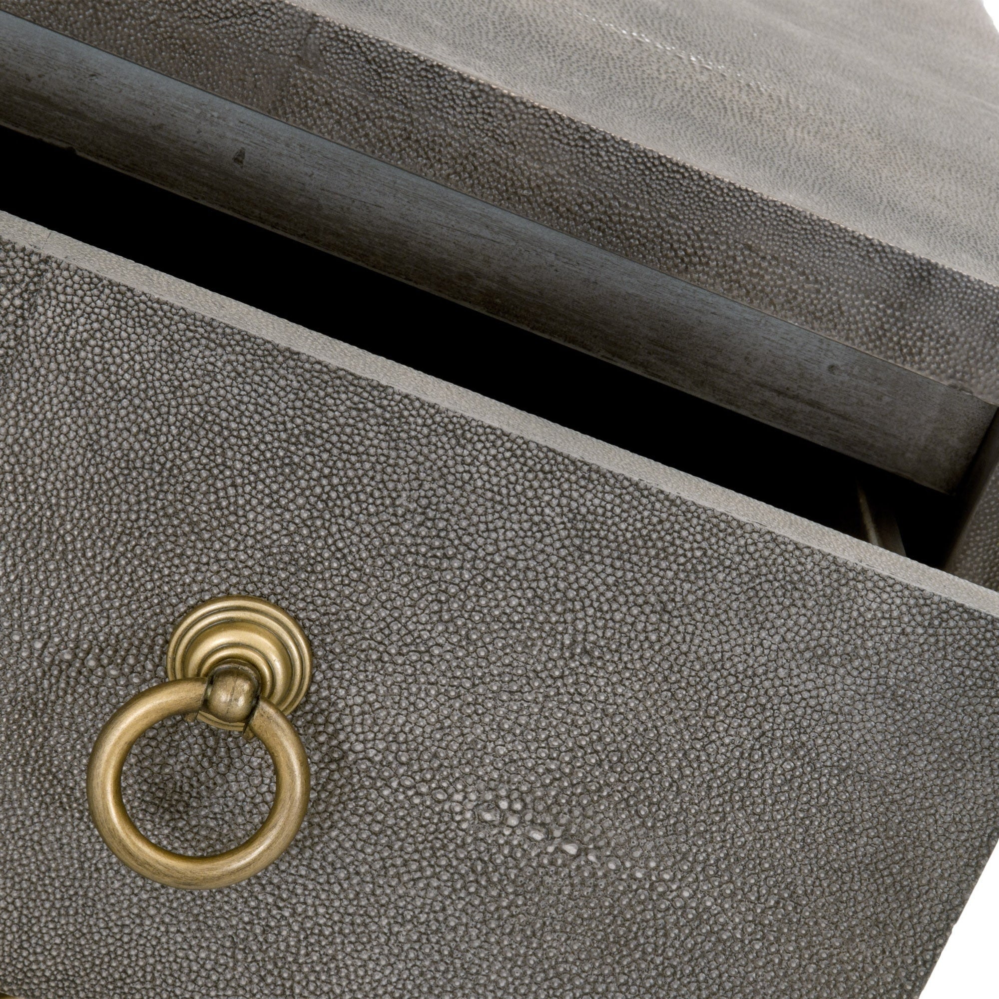 Close-up of a pearl white faux shagreen drawer with brushed gold ring pull on a luxury nightstand by Essentials For Living