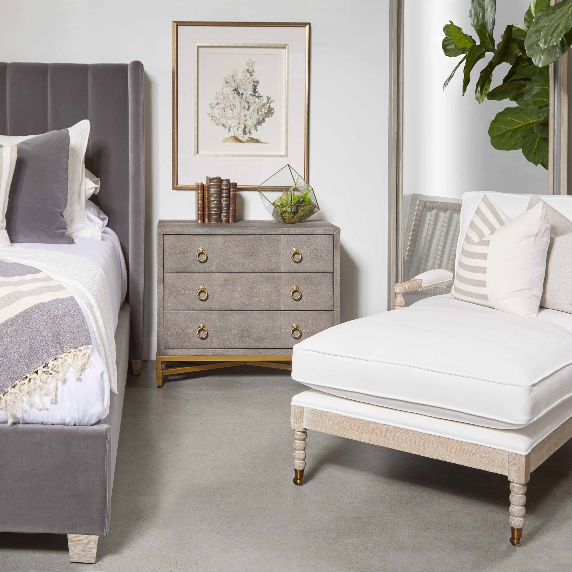 Essentials For Living Strand Shagreen nightstand with three drawers and brushed gold accents in a modern bedroom setting