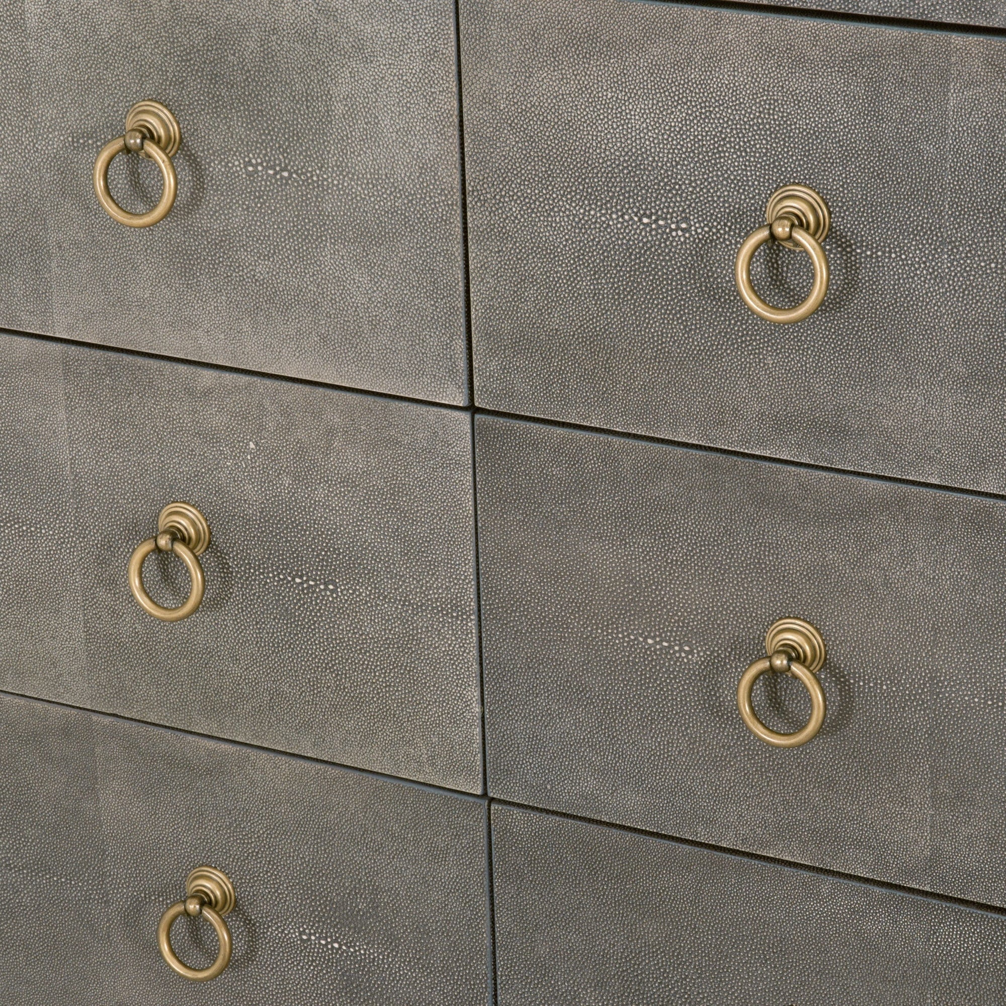 Close-up of pearl white faux shagreen dresser drawers with brushed gold ring pulls by Essentials for Living