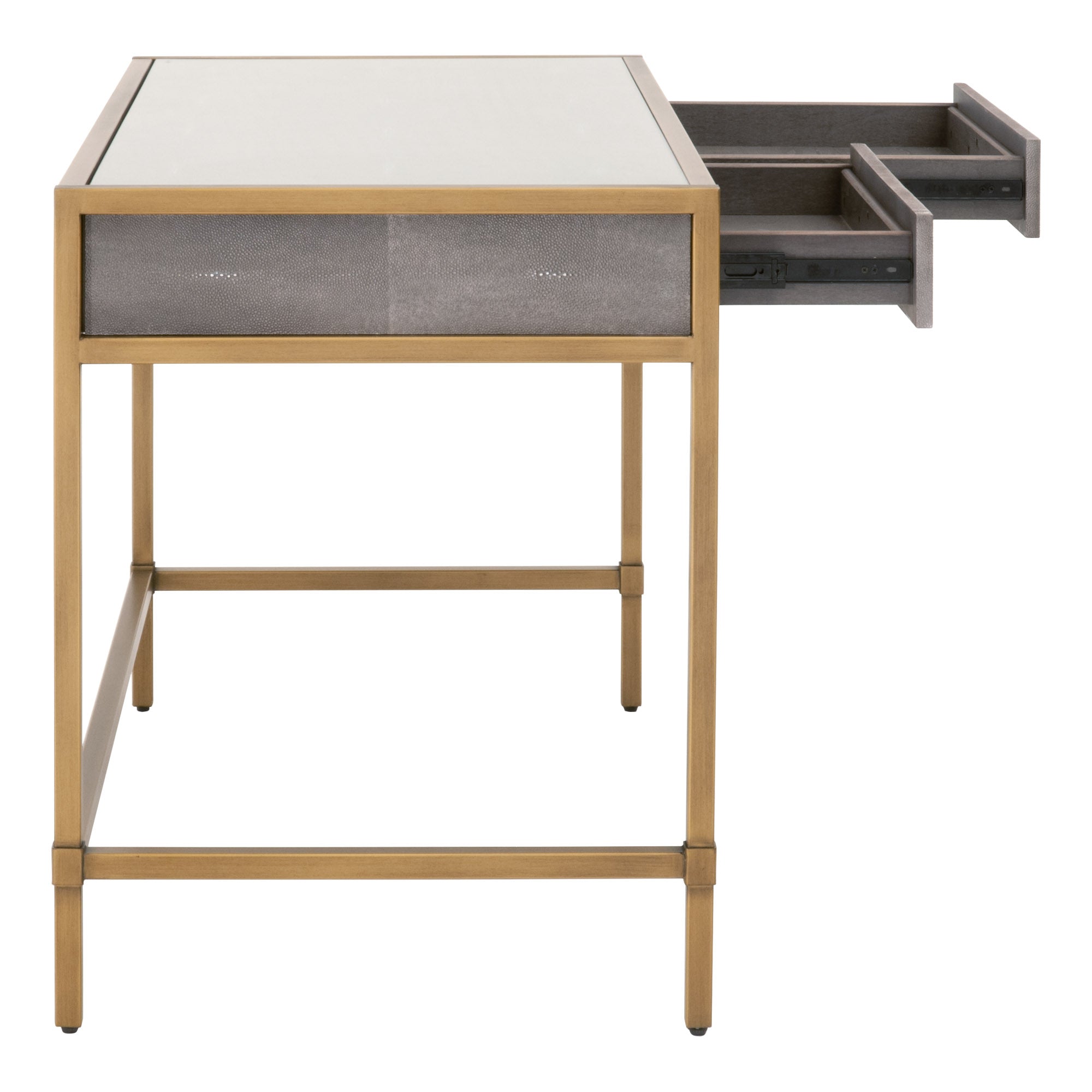 Pearl white faux shagreen desk by Essentials for Living with glass top, brushed gold base, and two open drawers.