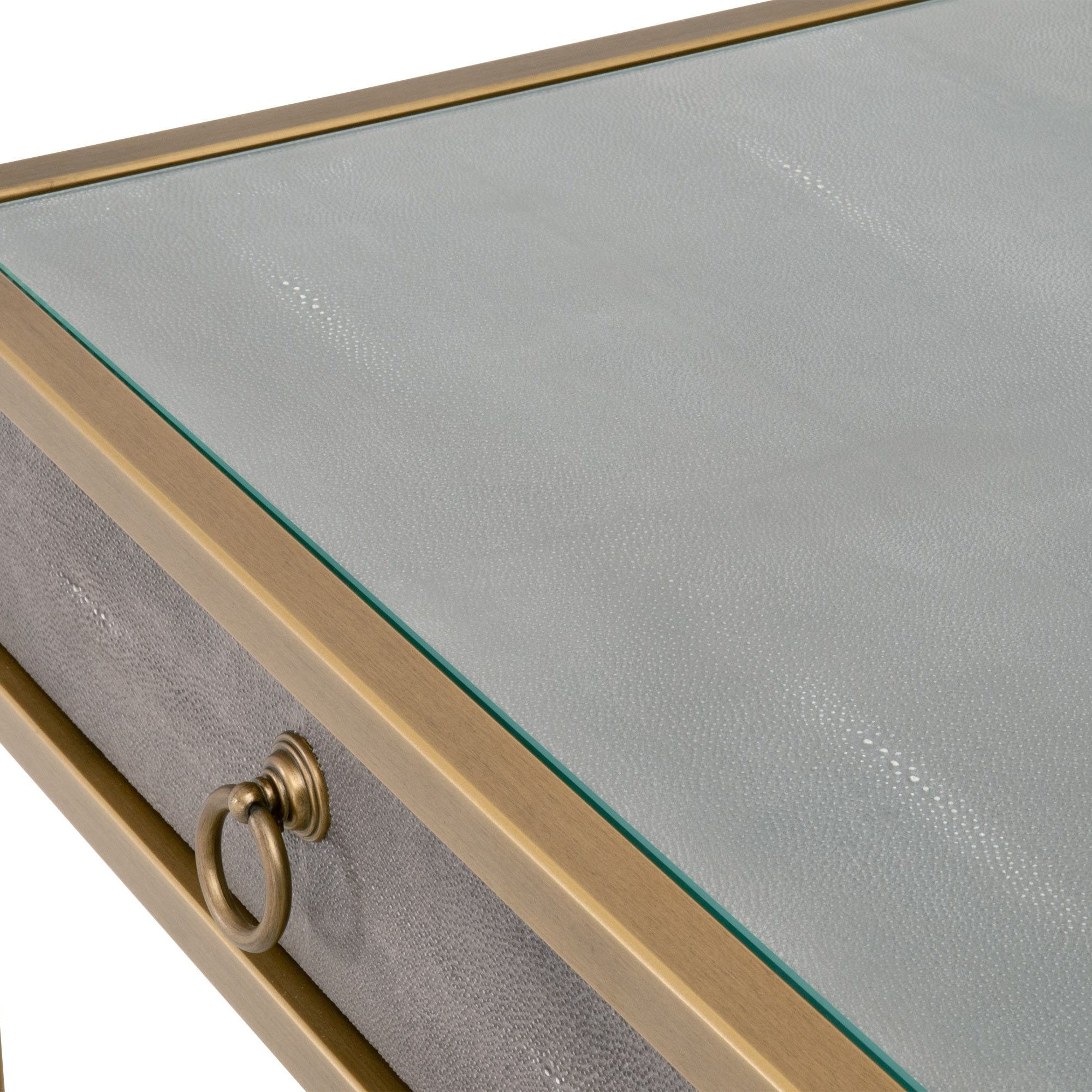 Close-up of pearl white faux shagreen desk top with glass surface and brushed gold drawer ring pull by Essentials for Living