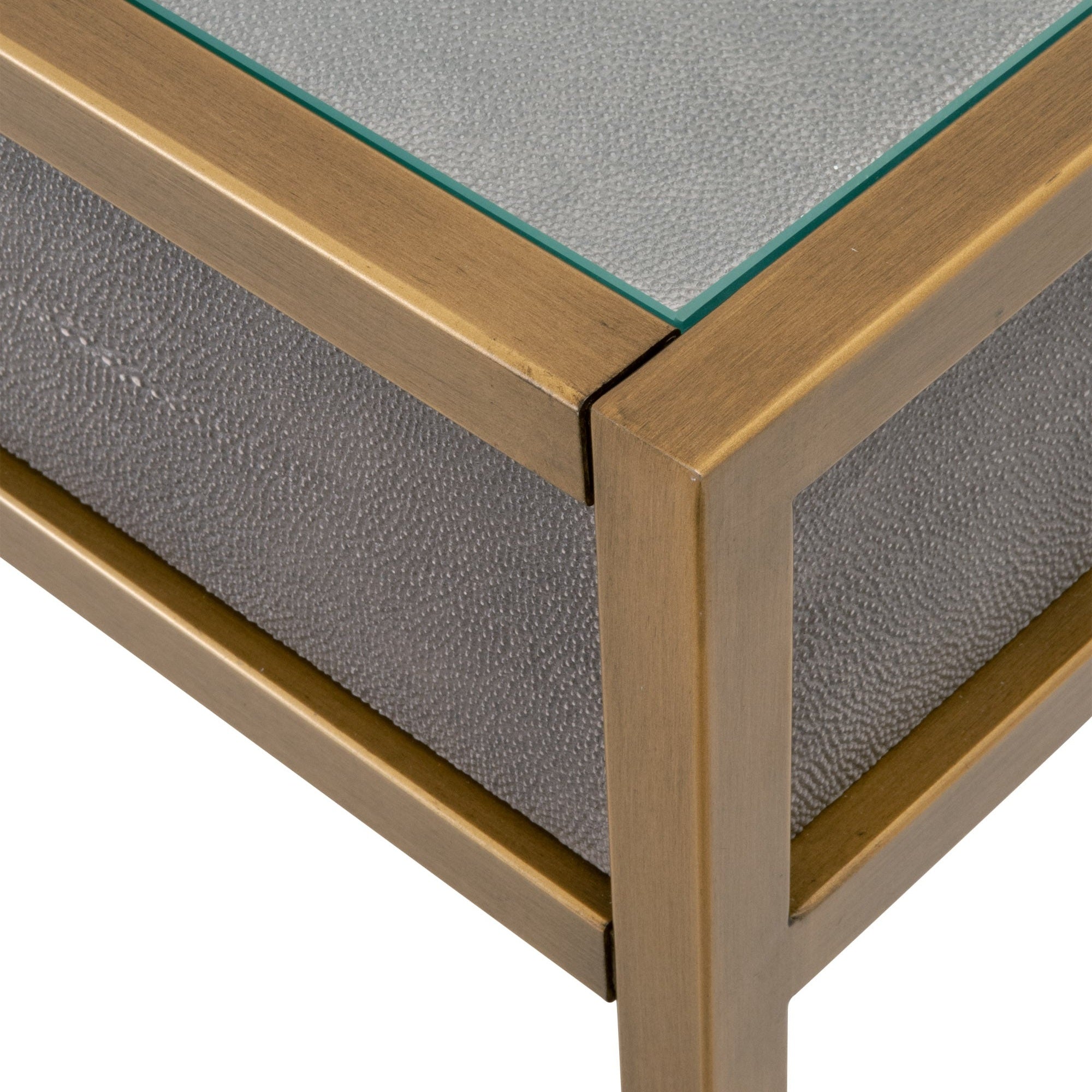 Close-up of pearl-white faux shagreen resin desk corner with brushed gold steel frame and glass top by Essentials for Living