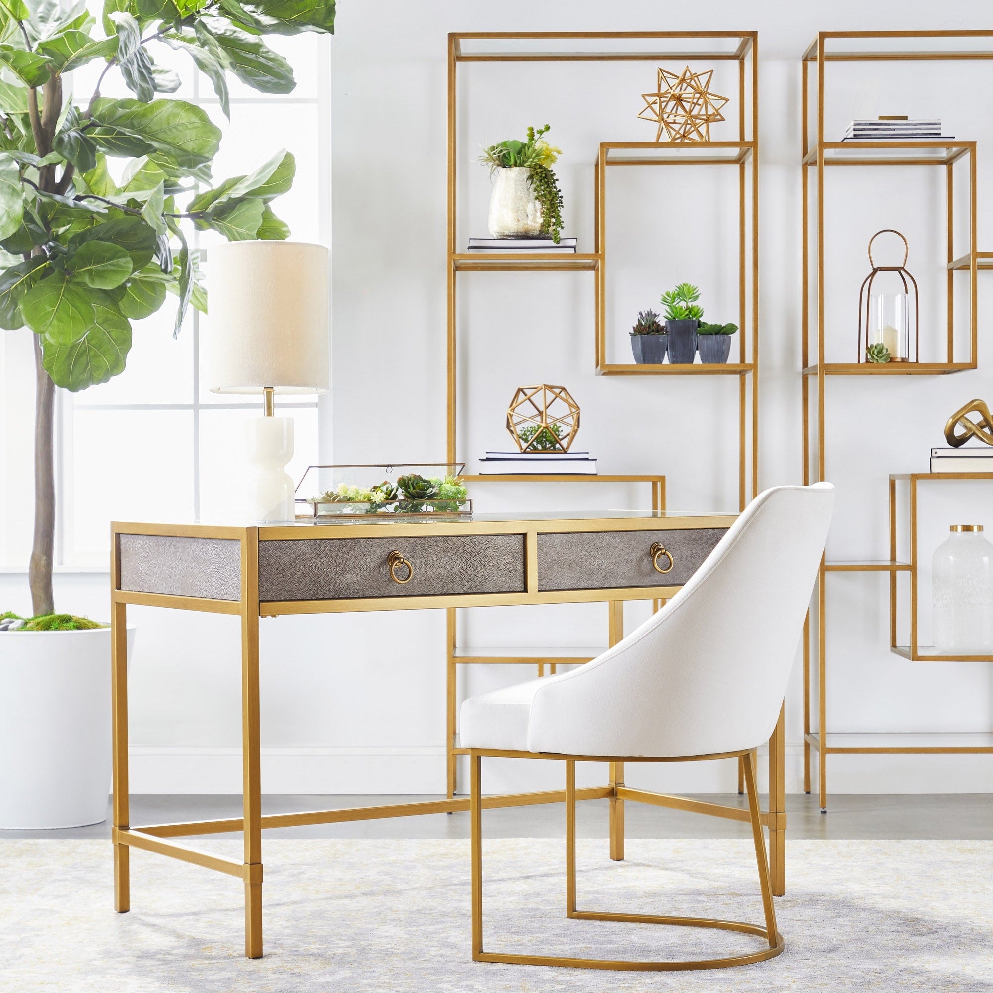 Essentials for Living Strand Shagreen Desk with pearl white finish, gold frame, glass top, and two drawers in stylish room setting