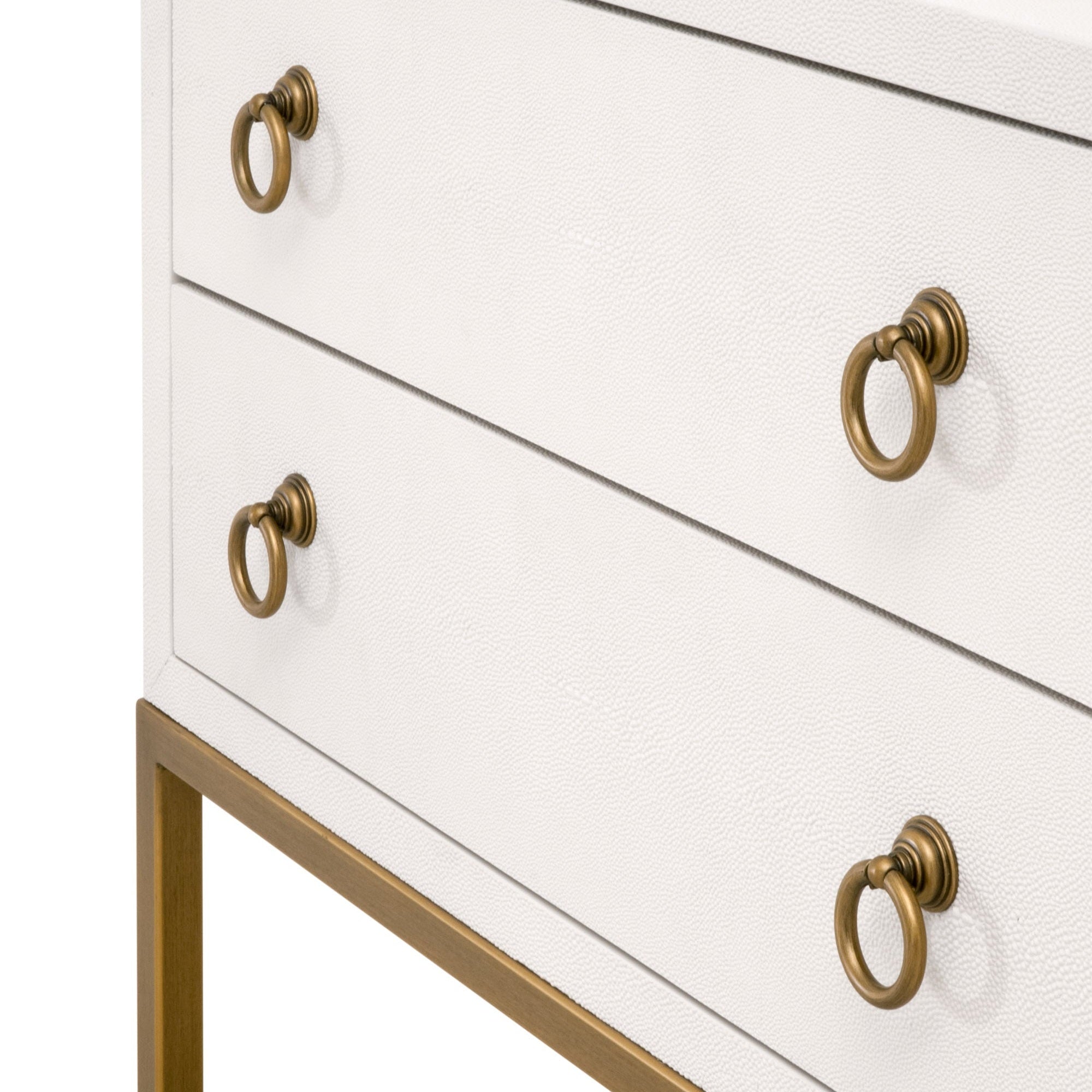 Close-up of white Strand Shagreen 2-drawer nightstand with brushed gold ring pulls and metal base by Essentials For Living.