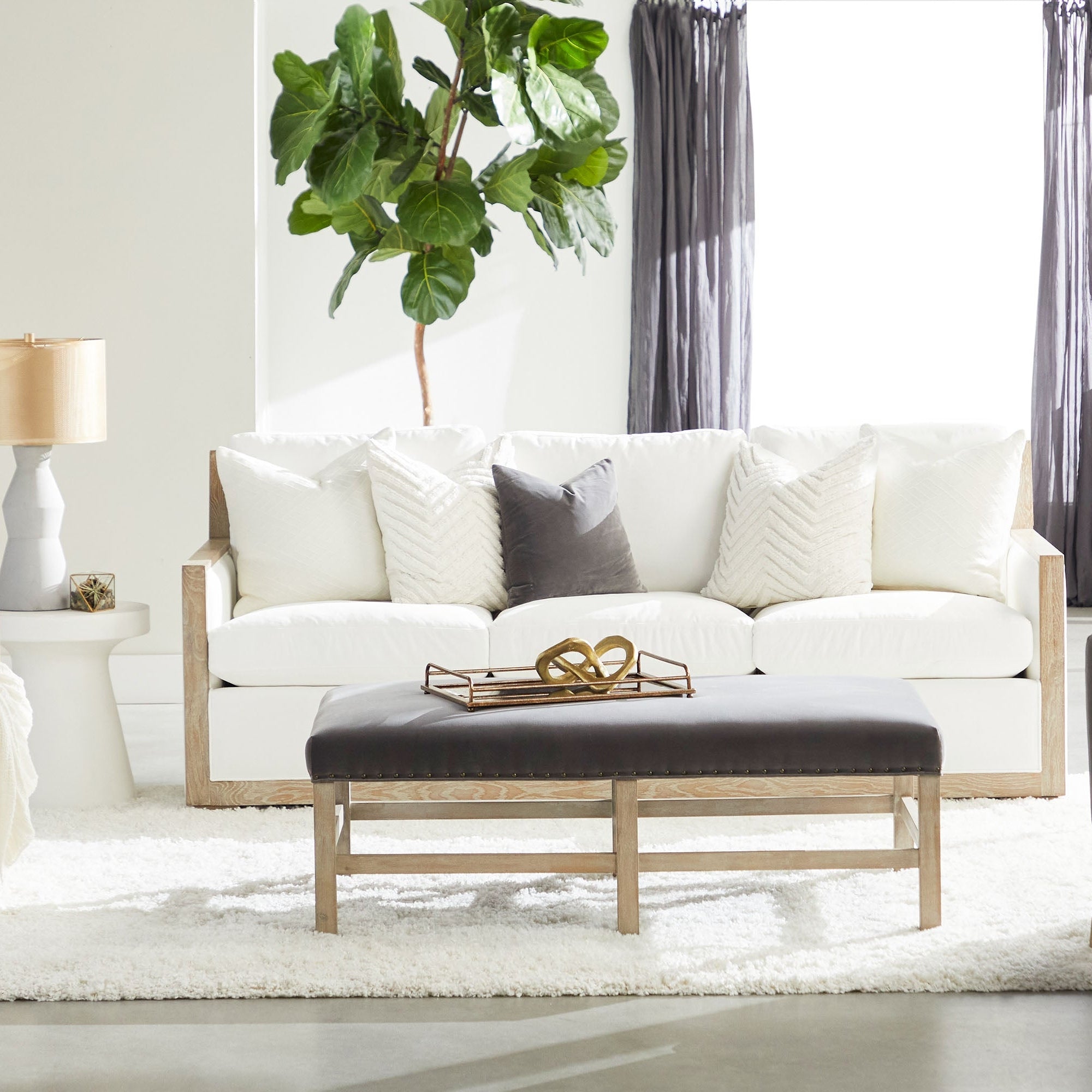 Ivory Tack Accent Table by Essentials For Living with tack-inspired design in a bright modern living room setting