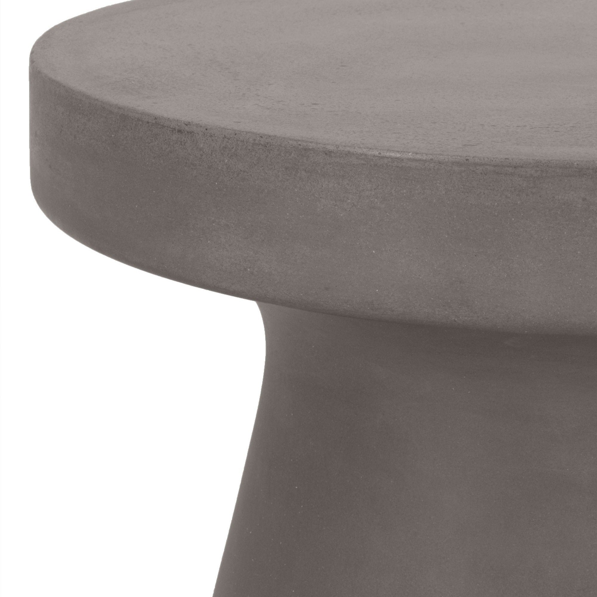 Close-up of a gray fiber-reinforced concrete accent table with a smooth round top and tapered base design