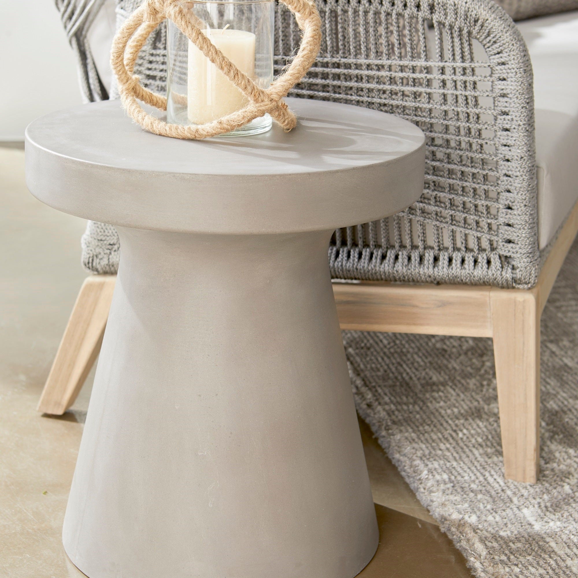 Essentials for Living Tack Accent Table in ivory fiber-reinforced concrete with modern tack-inspired design.