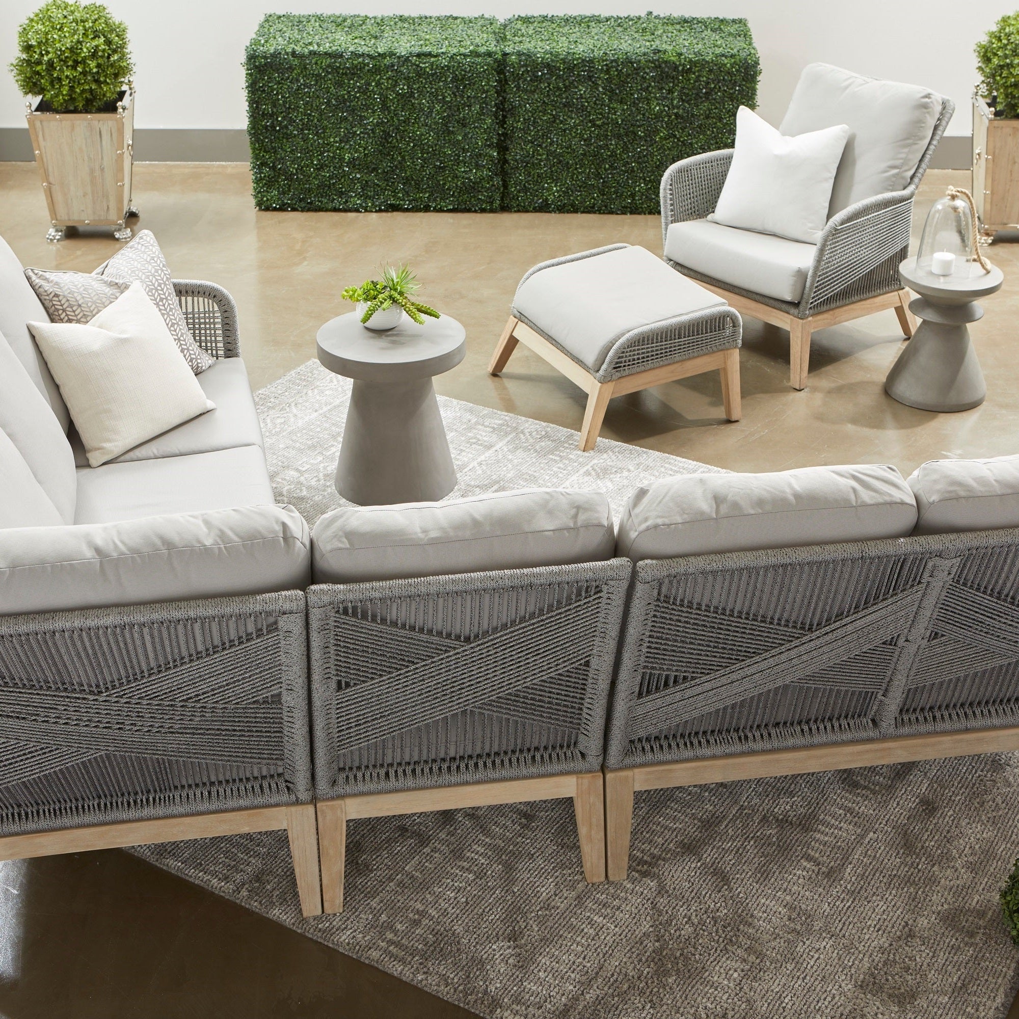 Essentials for Living Tack Accent Table in ivory fiber-reinforced concrete with modern outdoor seating arrangement