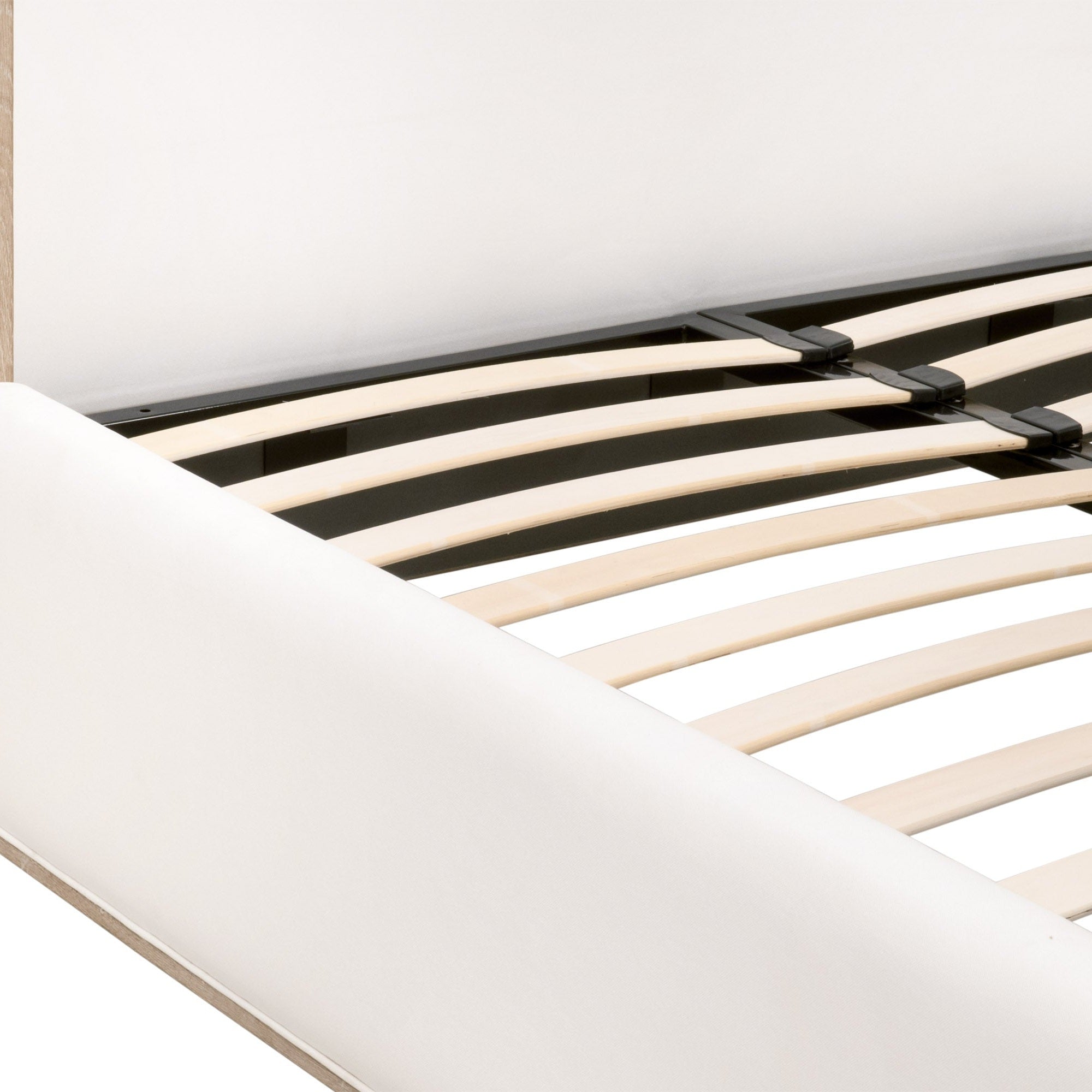 Close-up of Tailor Shelter Standard King Bed frame showing slatted metal and wooden support system with upholstered edges
