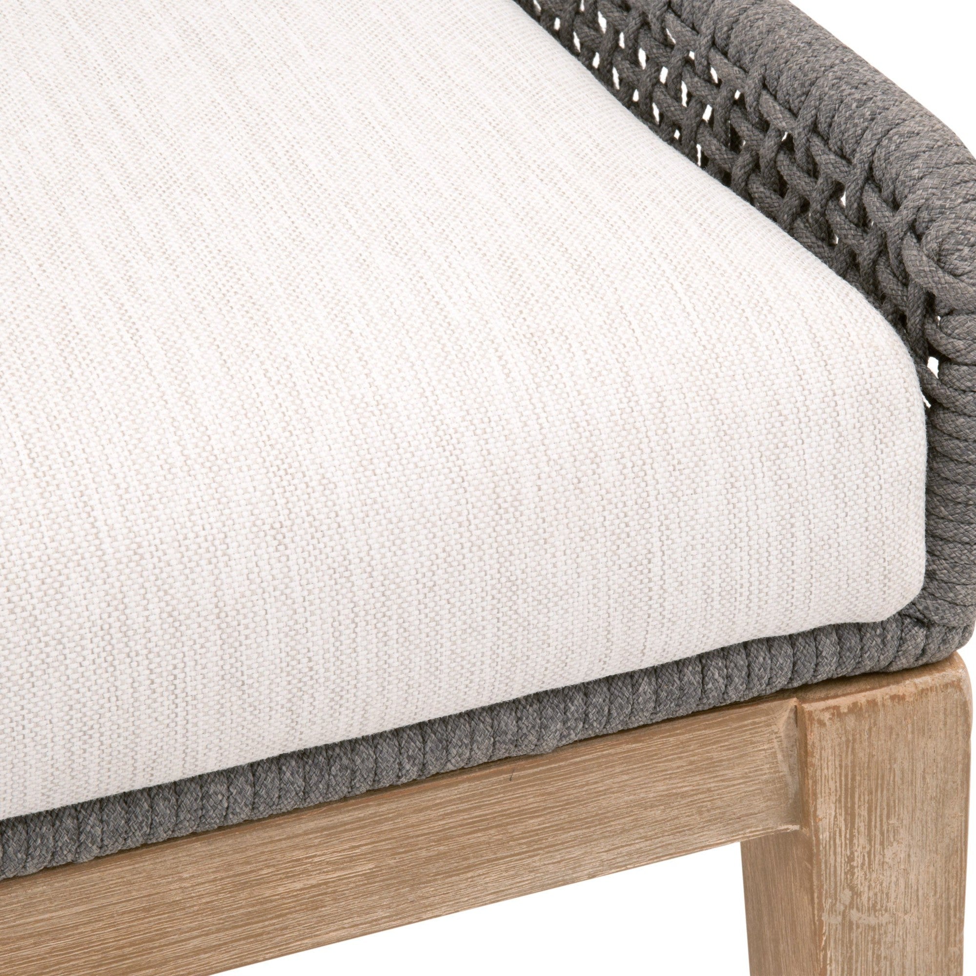 Close-up of woven taupe rope detail and pumice fabric seat cushion on wooden framed dining chair