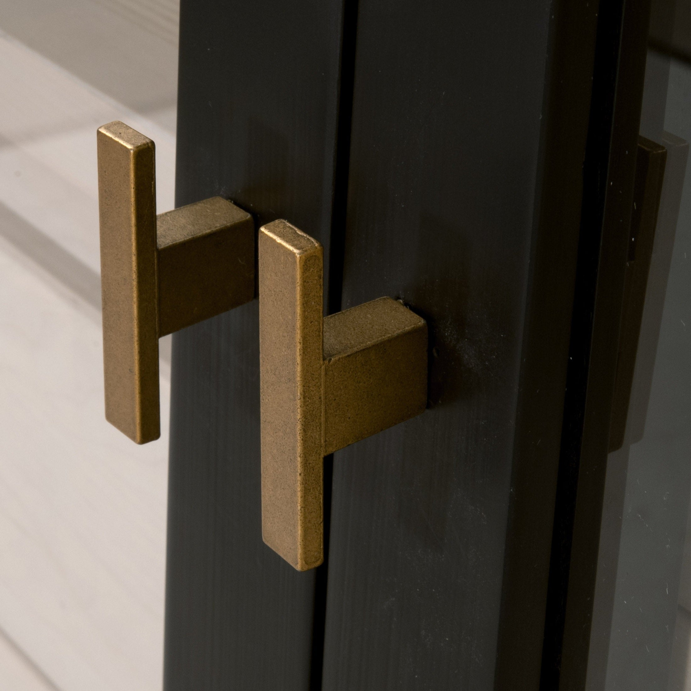 Brushed gold handles on black birch framed Toulouse Display Cabinet doors by Essentials for Living.