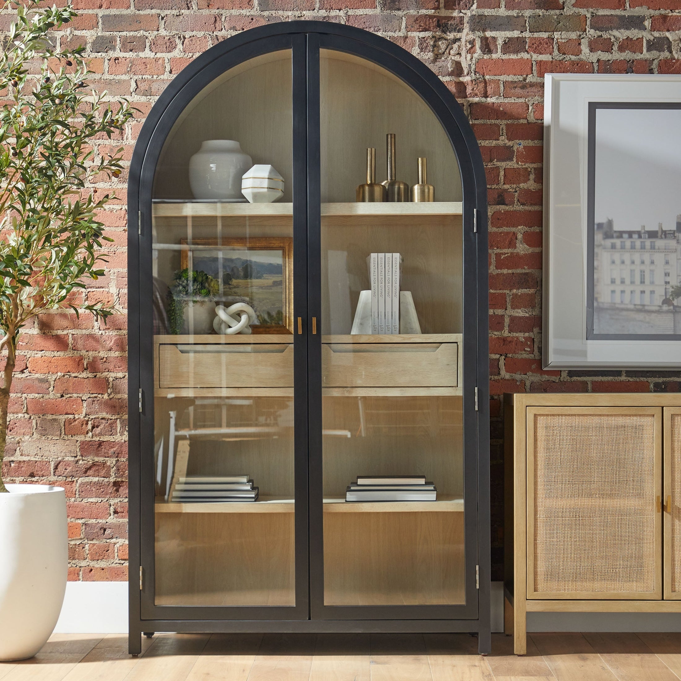 Toulouse Display Cabinet with black birch frame, arched tempered glass doors, natural oak shelves, and brushed gold accents