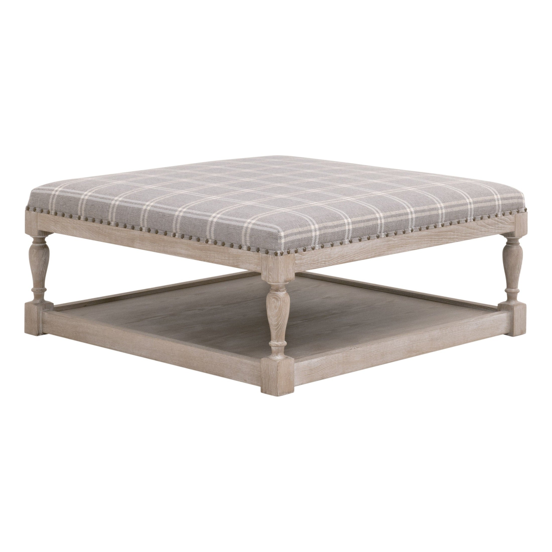 Townsend Upholstered Coffee Table with gray plaid fabric, gold nailhead trim, and natural gray ash wood base by Essentials for Living