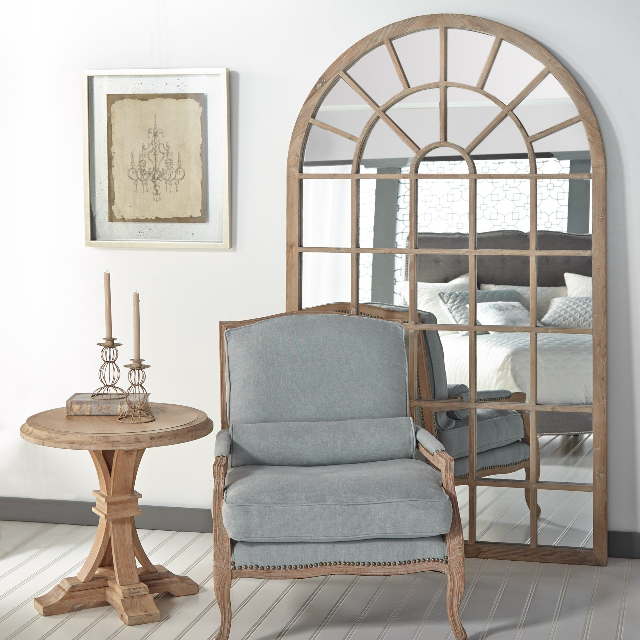 Essentials for Living Venetian floor mirror with arched reclaimed wood frame and grid overlay in light room setting