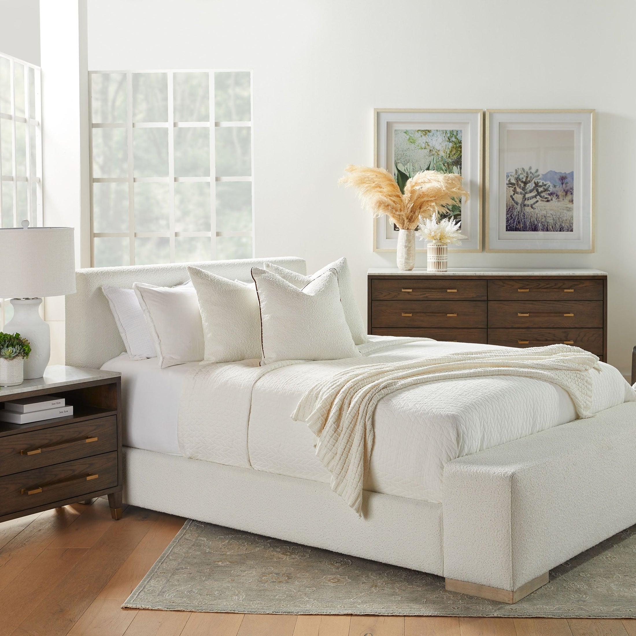 Essentials for Living Warren Standard King Bed with white boucle upholstery, oak legs, and a cozy bedroom setting