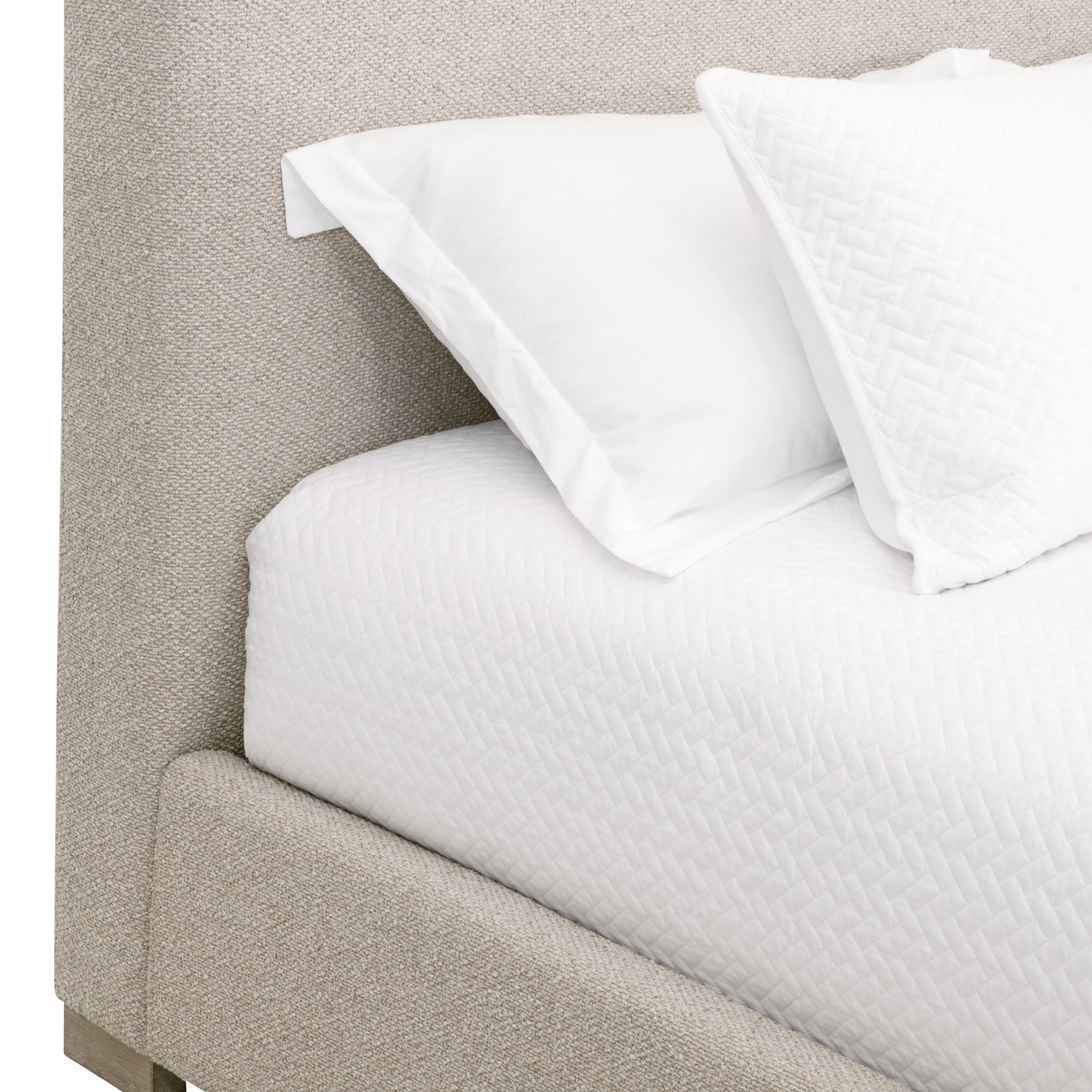 Close-up of Essentials For Living Warren Cal King Bed showcasing textured light upholstery and crisp white bedding