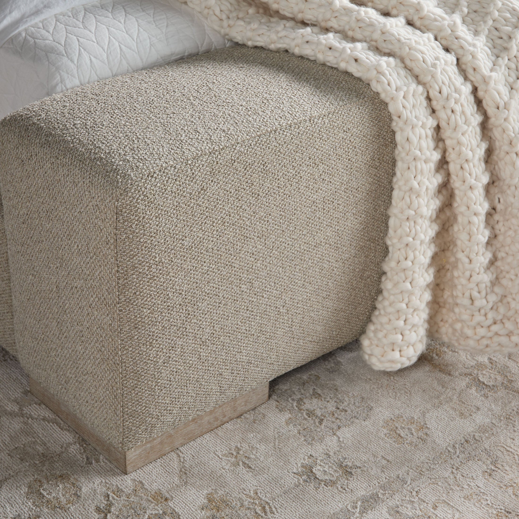 Close-up of the Warren Standard King Bed’s boucle upholstery and extra-wide footboard doubling as a bench by Essentials for Living