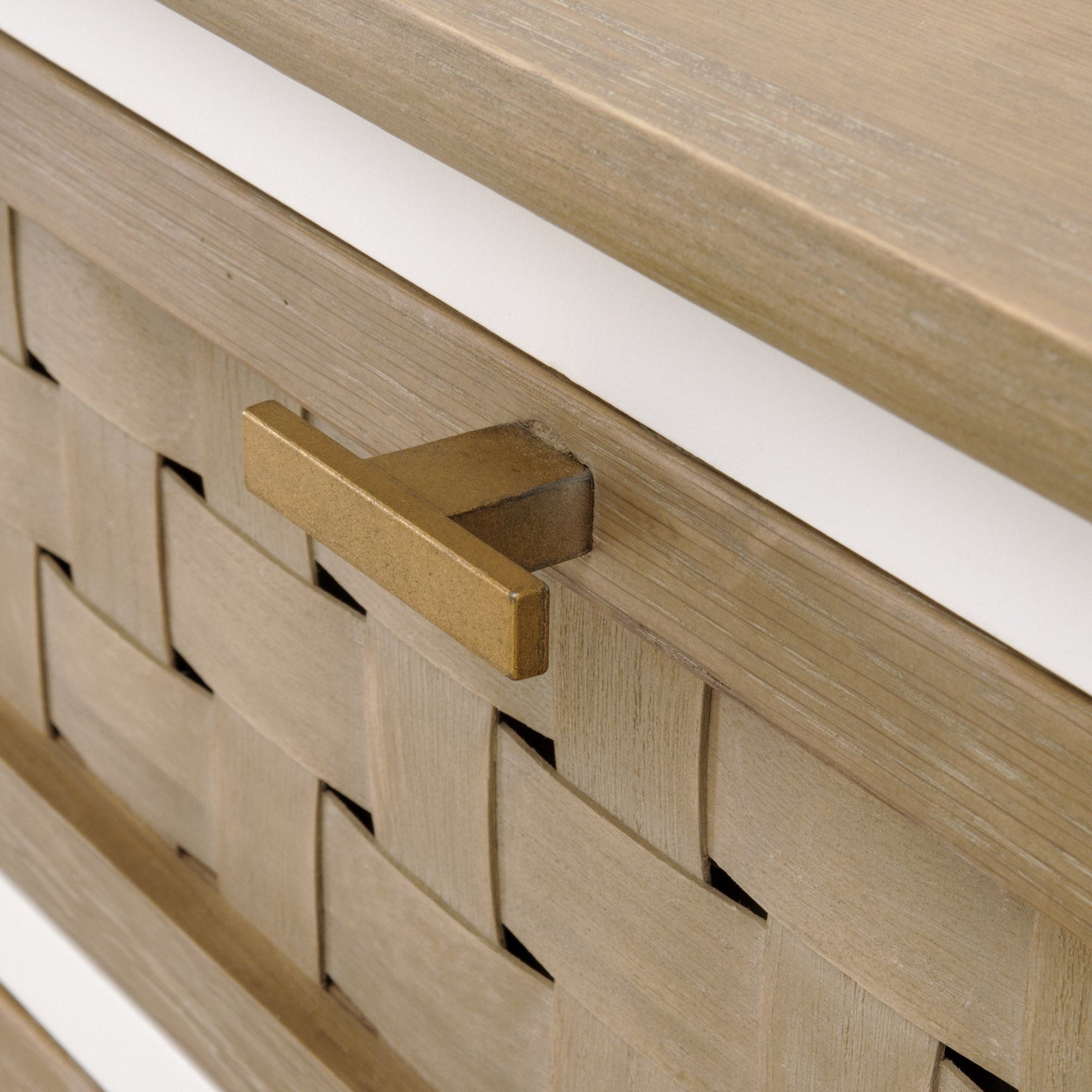 Close-up of basket weave textured drawer front with brass handle on Weave Entry Cabinet by Essentials For Living