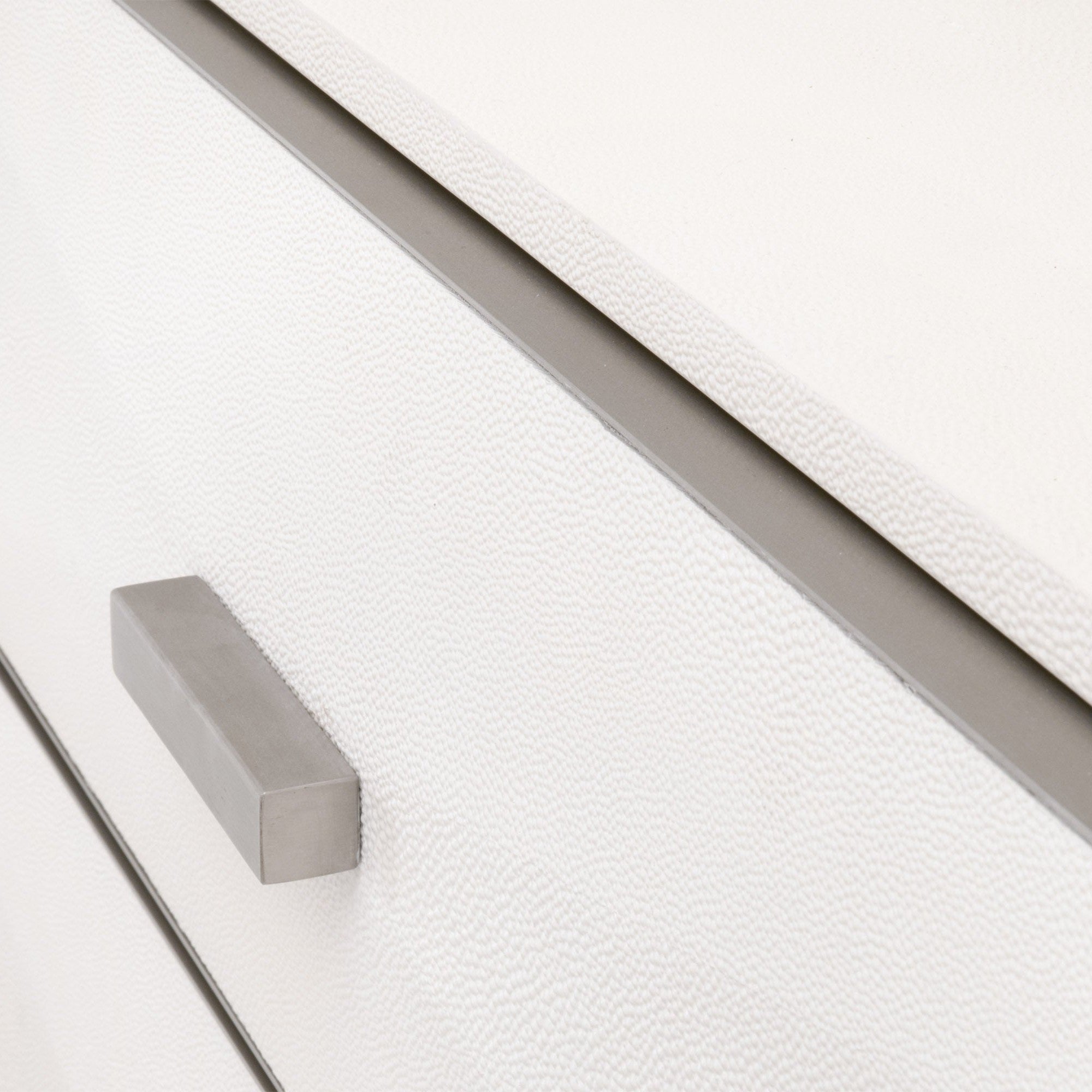 Close-up of pearl-white faux shagreen texture and brushed stainless steel handle on Wynn Shagreen 3-Drawer Nightstand