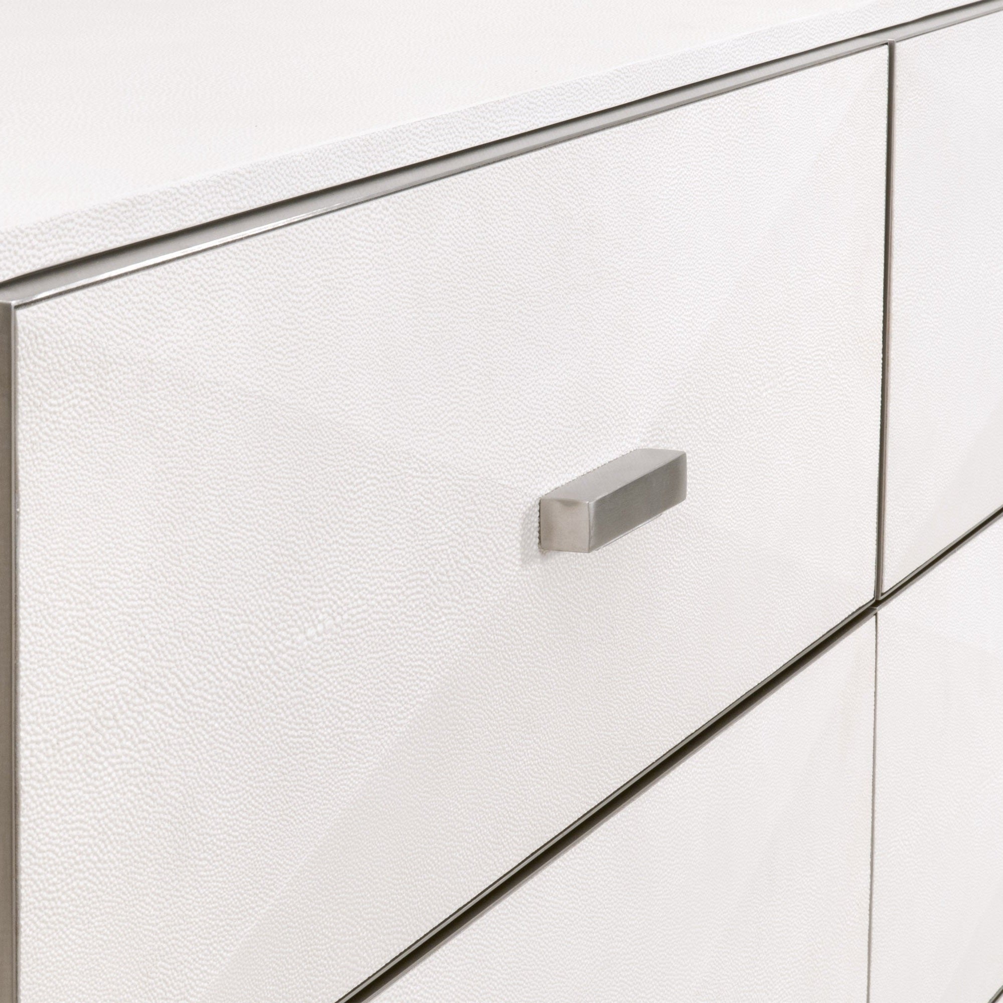 Close-up of pearl white faux shagreen resin drawer with brushed stainless steel handle on Wynn dresser by Essentials for Living